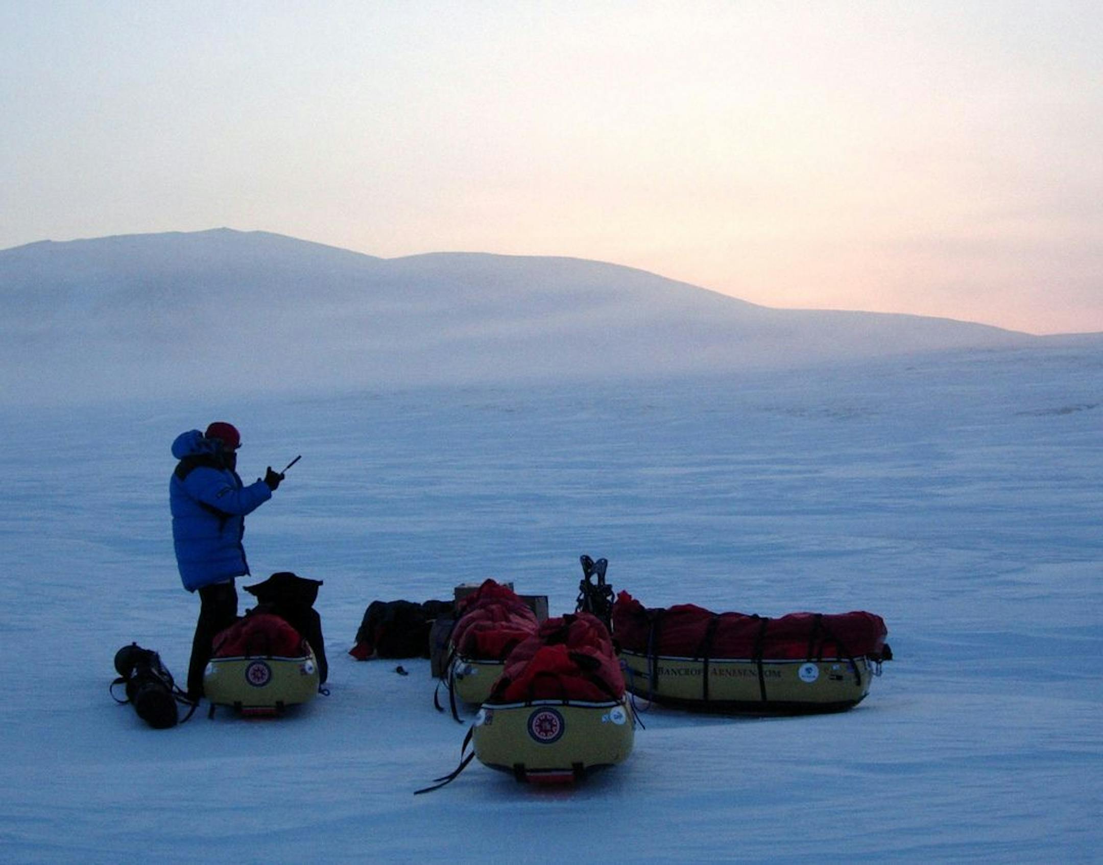 This photo provided by the Bancroft Arnesen Explore shows Ann Bancroft of Minnesota talking on a satellite phone during a North Pole expedition with Norwegian Liv Arnesen in Ward Hunt Island, Canada, Tuesday, March 6, 2007. What was intended to be a 530 mile (853 kilometers) trek across the Arctic Ocean to bring attention to global warming was called off March 10, after Arnesen suffered frostbite in three of her toes.