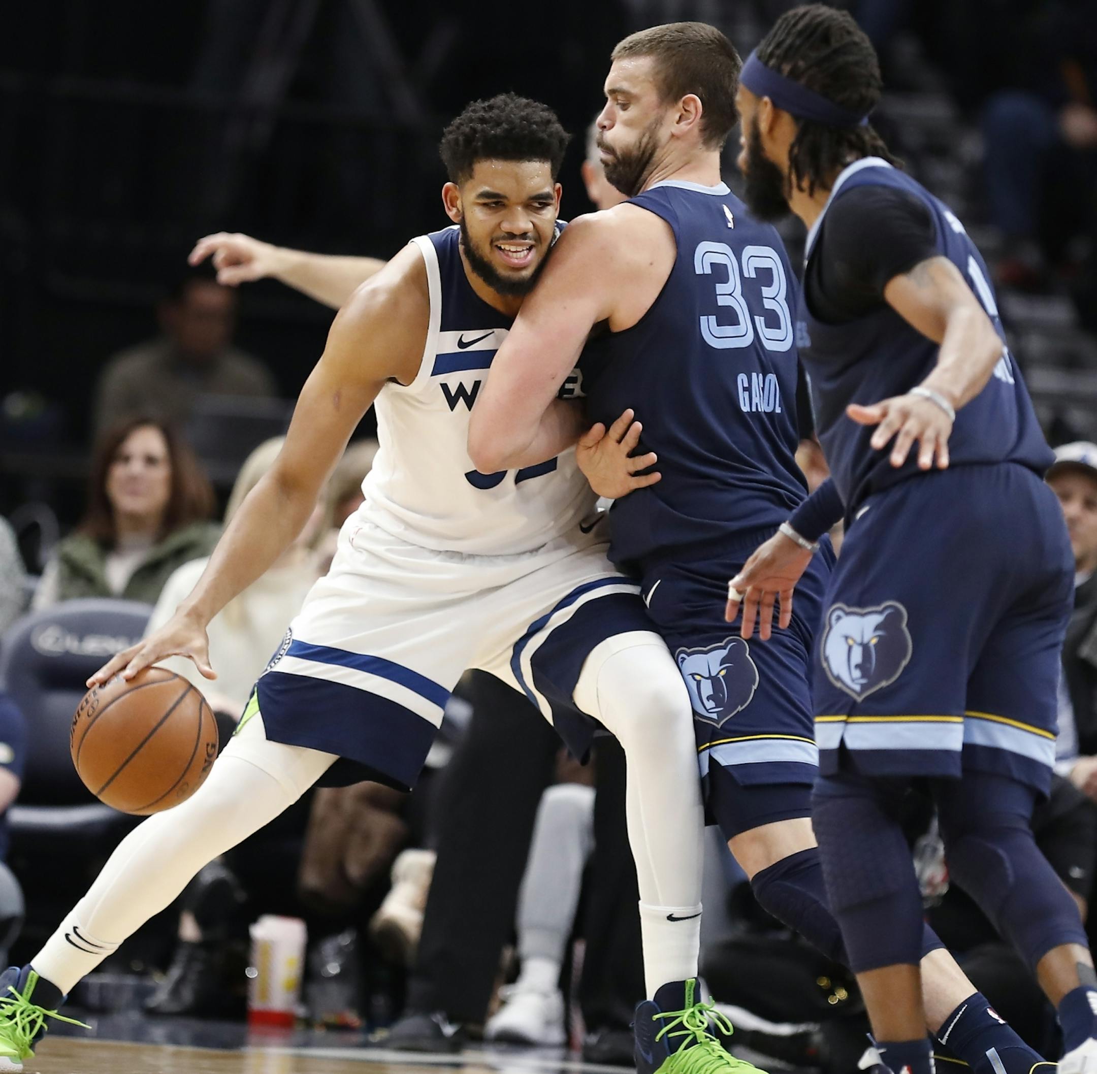 Minnesota Timberwolves center Karl-Anthony Towns (32) is rushed by Memphis Grizzlies center Marc Gasol (33) during the second half.