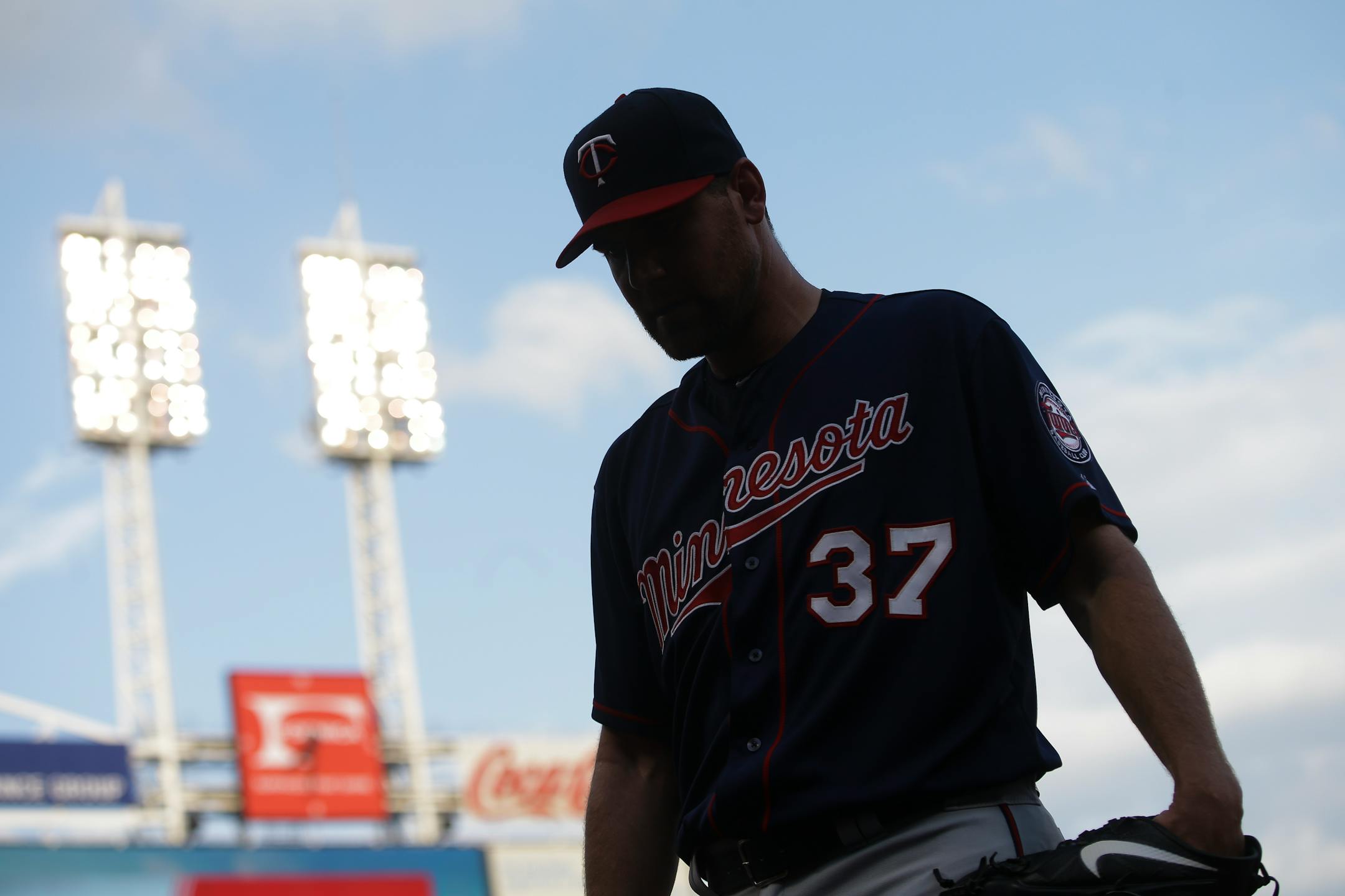 Twins starter Mike Pelfrey walked back to the dugout after giving up three runs in the first inning against Cincinnati. It would get worse for the righthander, who gave up eight runs and nine hits in two-plus innings.