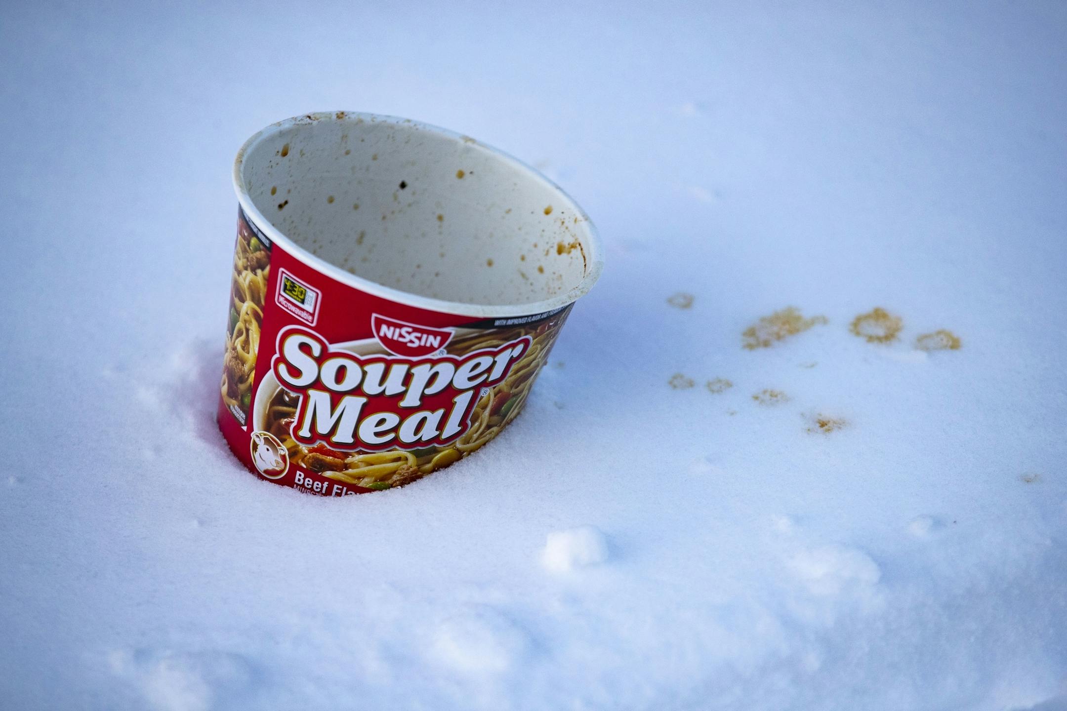 An abandoned soup cup laid in the snow in Duluth, MN on Sunday afternoon.