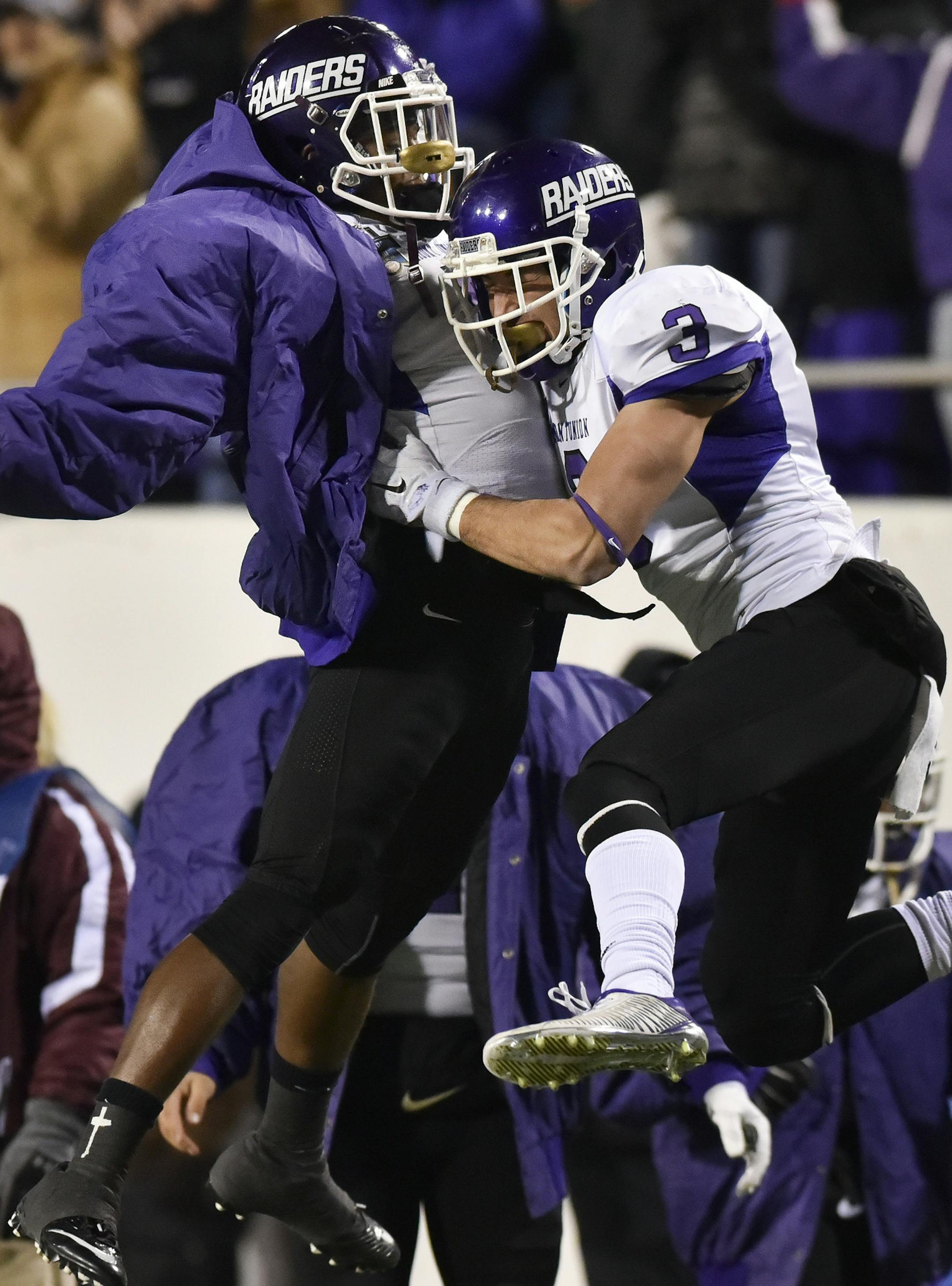 Mount Union wide receiver Roman Namdar (3) celebrates his touchdown reception with defensive back Tre Jones, against St. Thomas during the first half of the NCAA Division III football championship game in Salem, Va., Friday, Dec. 18, 2015. (AP Photo/Michael Shroyer)