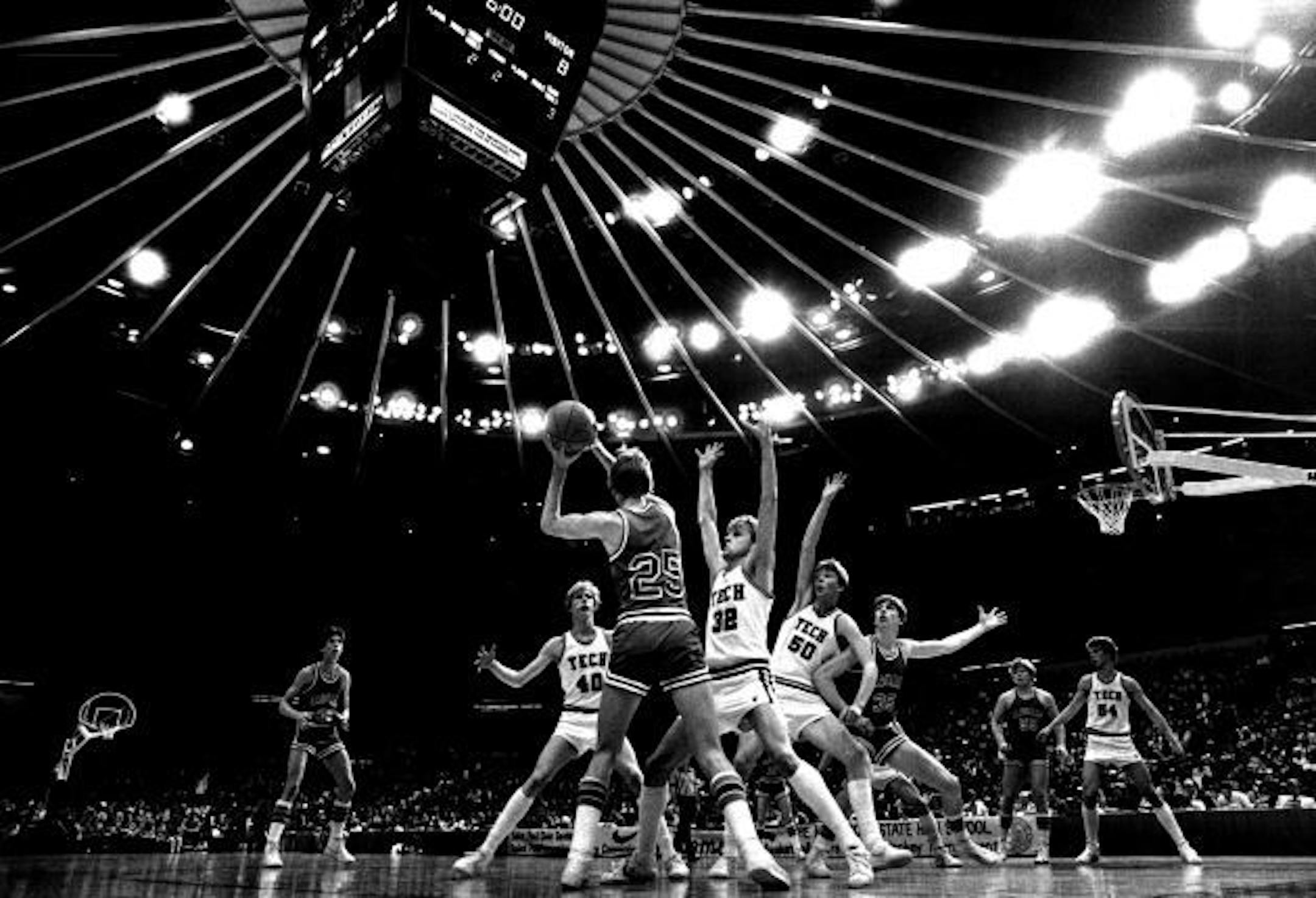 March 27, 1982 Tim Lynch (25) of Bloomington Jefferson looked for someone to pass to Friday afternoon. Surrounding him were Kevin Grote (40), Johnson (32) and Dave Imholte (50) of St. Cloud Tech. Jostling with Dan Imholte was the Jaguars' Steve Hill (35).  Donald Black, Minneapolis Star Tribune