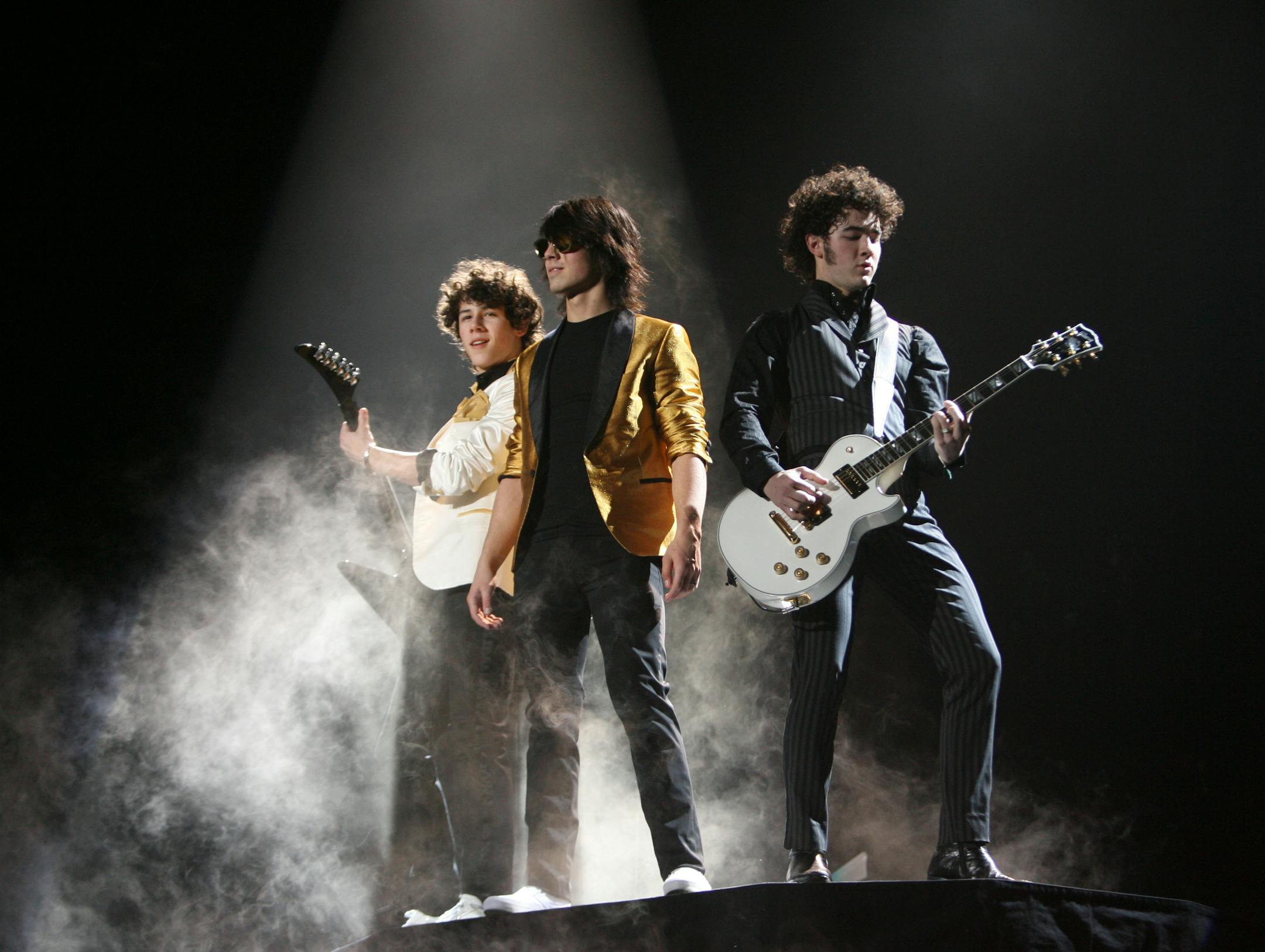 The Jonas Brothers early in their set at Target Center Wednesday night in Minneapolis. They are, from left, Nick, 15, Joe, 18, and Kevin, 20.