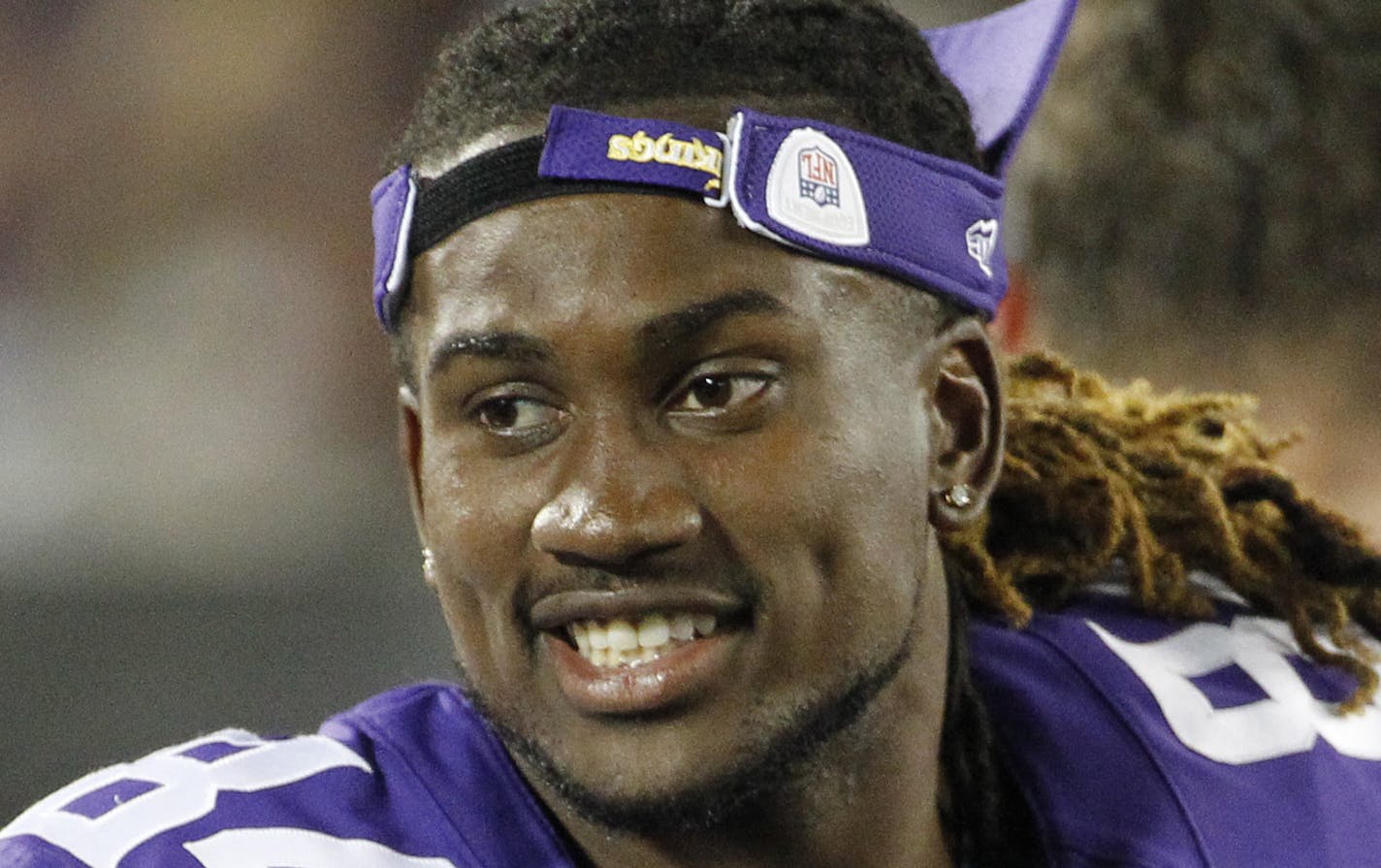 Minnesota Vikings wide receiver Cordarrelle Patterson (84) talks with a teammate in the second half of a preseason NFL football game against the Tampa Bay Buccaneers at TCF Bank Stadium Saturday, Aug. 15, 2015, in Minneapolis. (AP Photo/Ann Heisenfelt)