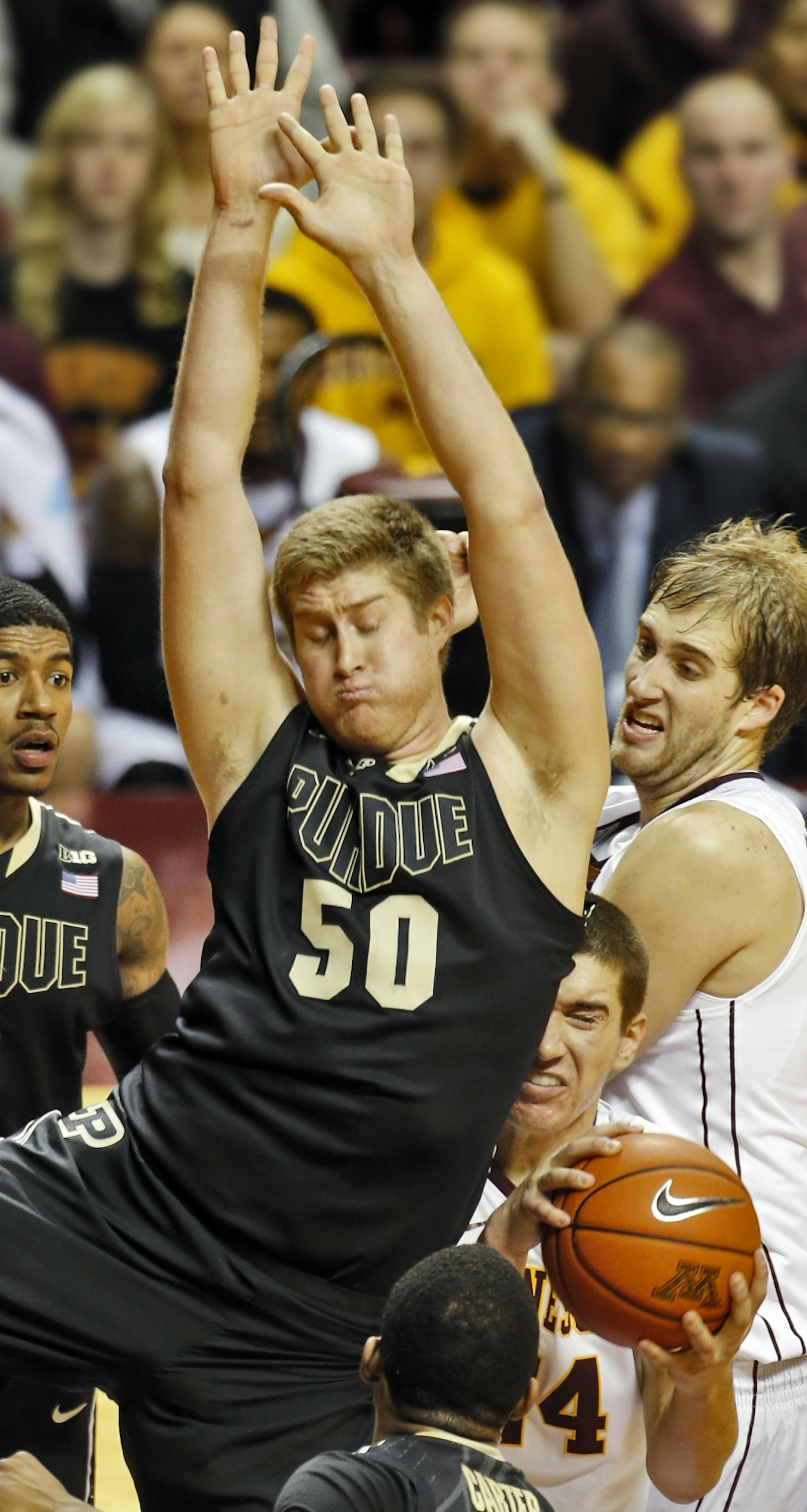 Minnesota Gophers mens basketball vs. Purdue. Minnesota won 82-79. Minnesota's Joey King was fouled by Purdue's Travis Carroll (50) as King went up for a 2nd half shot. (MARLIN LEVISON/STARTRIBUNE
