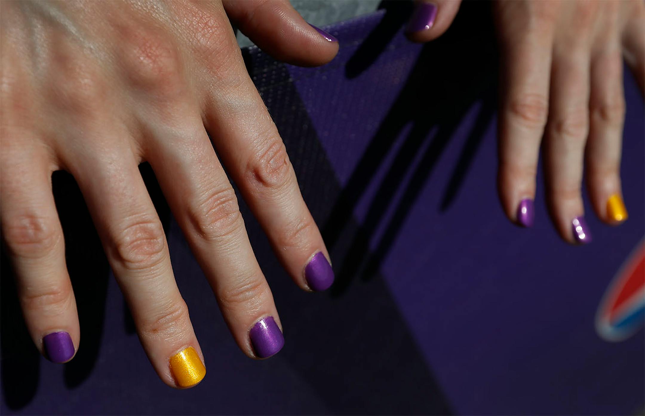 Devon Spooner, 28, of Duluth painted her nails in Minnesota Vikings colors.