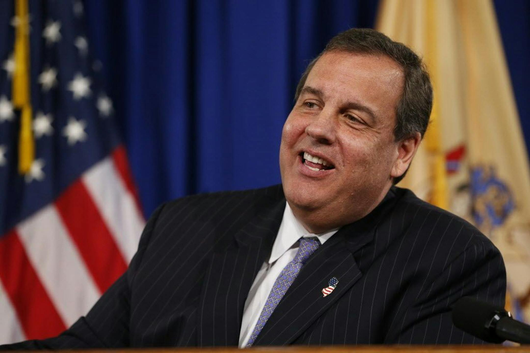 New Jersey Gov. Chris Christie speaks to reporters during a news conference following his signing of the state's 2016 budget, Friday, June 26, 2015, in Trenton, N.J. Christie vetoed more than $1.6 billion from the 2016 budget approved by the Democratic-controlled Legislature and signed a roughly $34 billion budget into law.