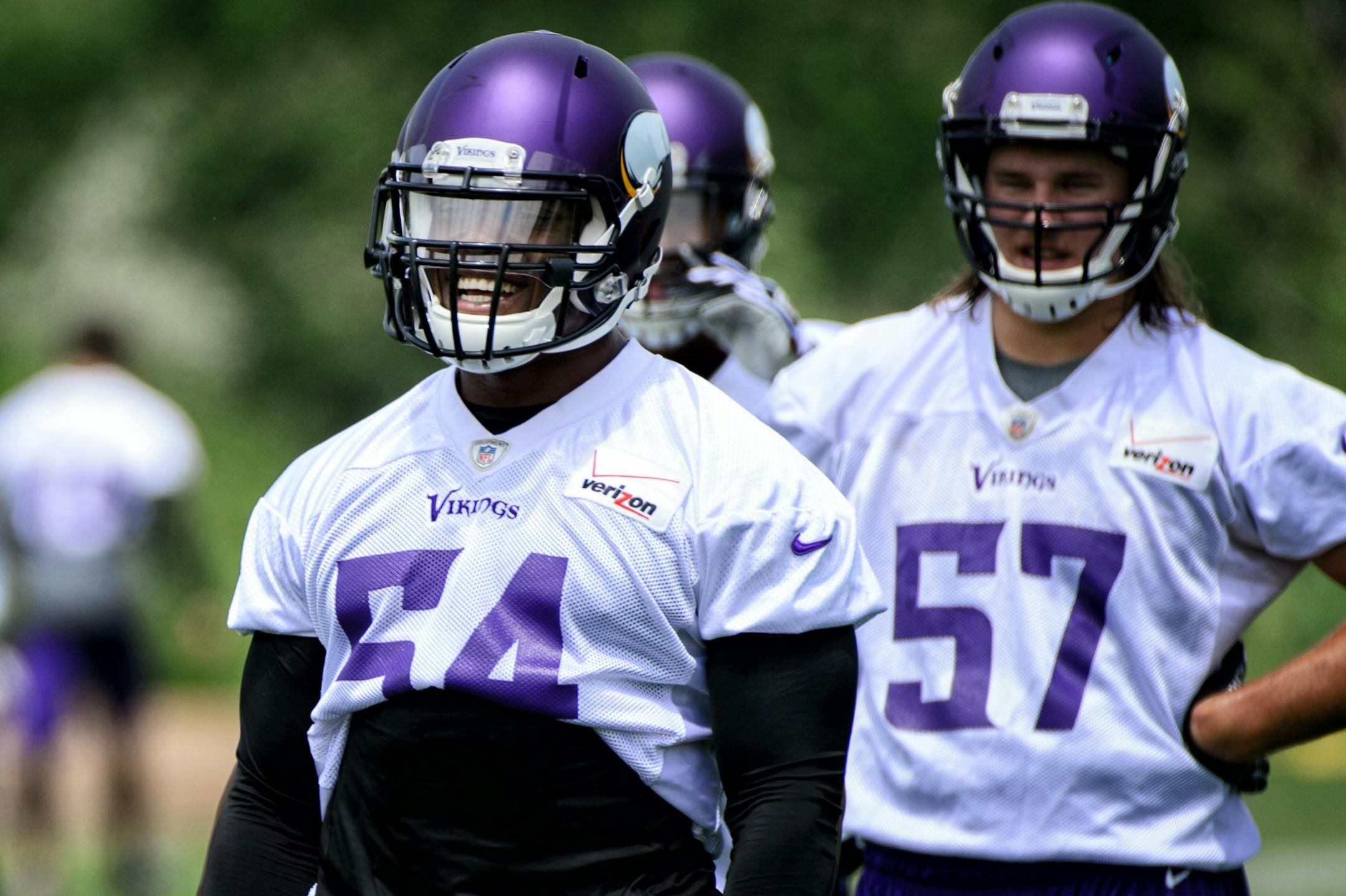 Jasper Brinkley (54) and Audie Cole (57) are battling for time at middle linebacker.