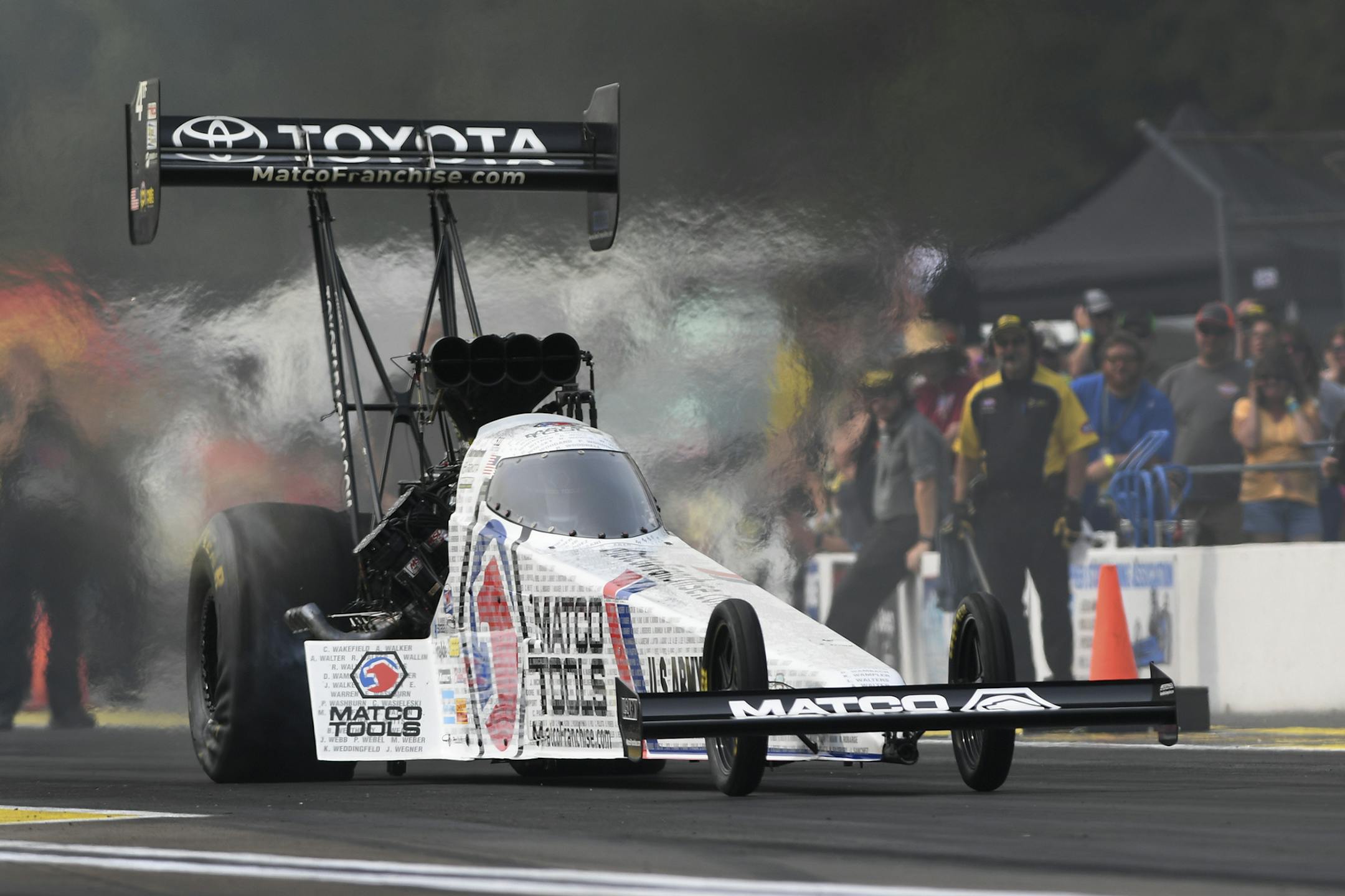 In this photo provided by the NHRA, Antron Brown drives to the Top Fuel preliminary No. 1 qualifier at the Lucas Oil NHRA Nationals drag races Friday, Aug. 17, 2018, at Brainerd International Raceway in Brainerd, Minn. Brown powered to a 3.789-second pass at 325.45 mph. (Marc Gewertz/NHRA via AP)
