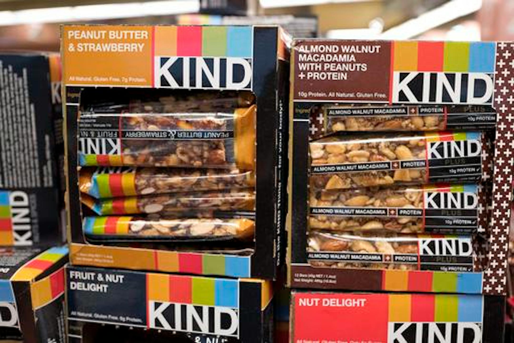 Kind snack bars are displayed in a New York supermarket, Thursday, Feb. 9, 2017. Kind CEO Daniel Lubetzky is pledging $25 million over the next 10 years to create a nonprofit dedicated to "revealing and countering" the food industry's influence on public health. The move underscores the division between "Big Food" companies and newer players that market themselves as wholesome alternatives aligned with public health. (AP Photo/Mark Lennihan)