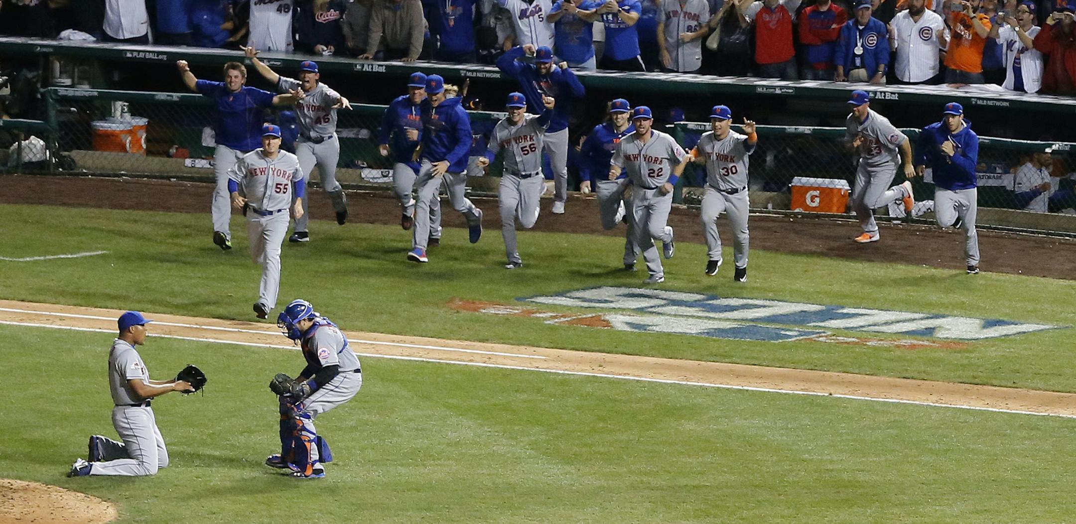 The New York Mets celebrate after Game 4 of the National League baseball championship series against the Chicago Cubs Wednesday, Oct. 21, 2015, in Chicago. The Mets won 8-3 to advance to the World Series. (AP Photo/Charles Rex Arbogast)