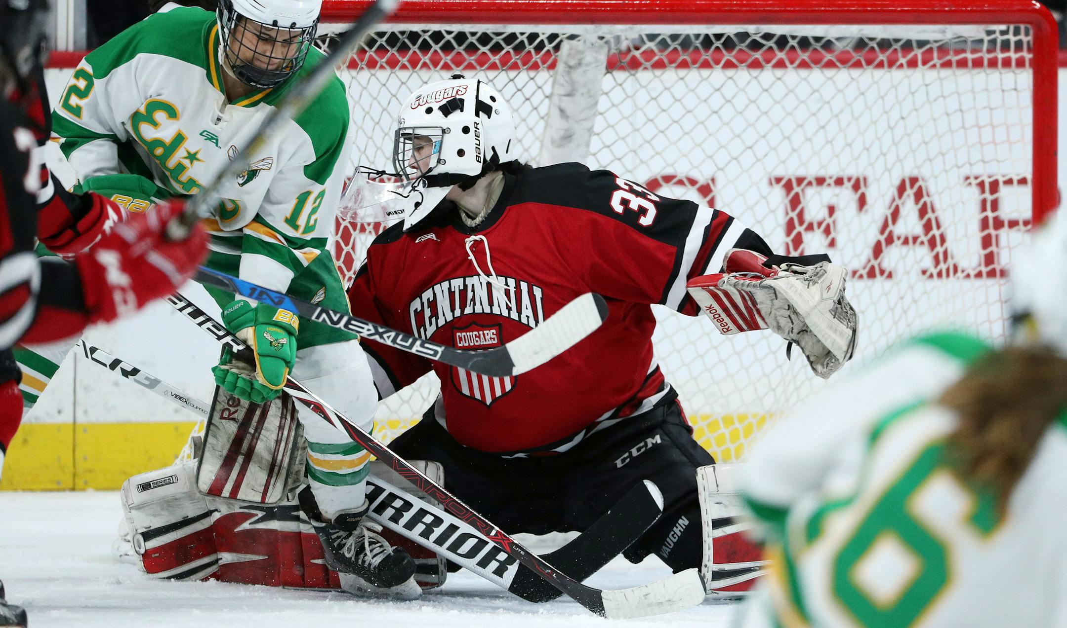 Edina High School forward Lolita Fidler (12) deflected a shot past Centennial High School goaltender Mackenna Stoterau (33) to score in the second period. ] ANTHONY SOUFFLE ï anthony.souffle@startribune.com Game action from a MSHSL Class 2A girl's hockey championship game between Edina High School and Centennial High School Saturday, Feb. 24, 2018 at the Xcel Energy Center in St. Paul, Minn.