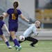 Rochester Lourdes goalkeeper Lauren Nickels (1) nearly allowed an Orono goal in the first half but was saved by defender Julia Buntrock (2).