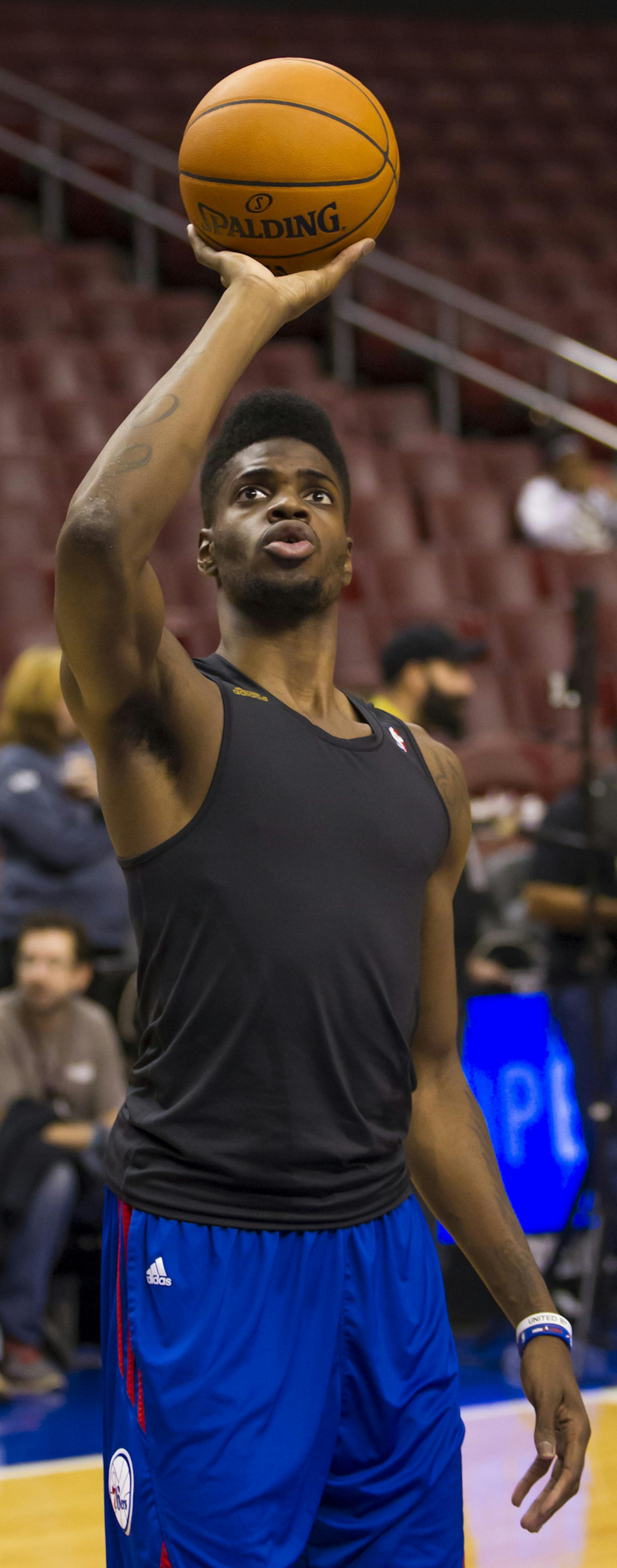 Philadelphia 76ers' Nerlens Noel runs drills during warm-ups of a preseason NBA basketball game against the Brooklyn Nets, Monday, Oct. 14, 2013, in Philadelphia. The Nets win 127-97. (AP Photo/Chris Szagola) ORG XMIT: OTKCS103