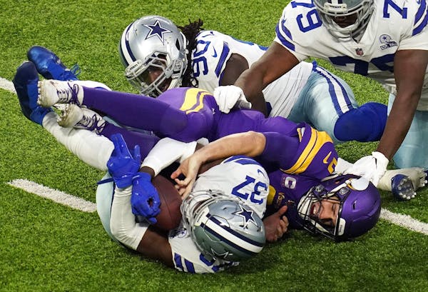 Minnesota Vikings quarterback Kirk Cousins (8) had the ball stripped away by Dallas Cowboys safety Donovan Wilson (37) resulting in a turnover in the 
