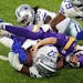 Minnesota Vikings quarterback Kirk Cousins (8) had the ball stripped away by Dallas Cowboys safety Donovan Wilson (37) resulting in a turnover in the 