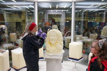 Artist Linda Christensen carved a solid block of butter in the Dairy Building at the Minnesota State Fair in 2018.