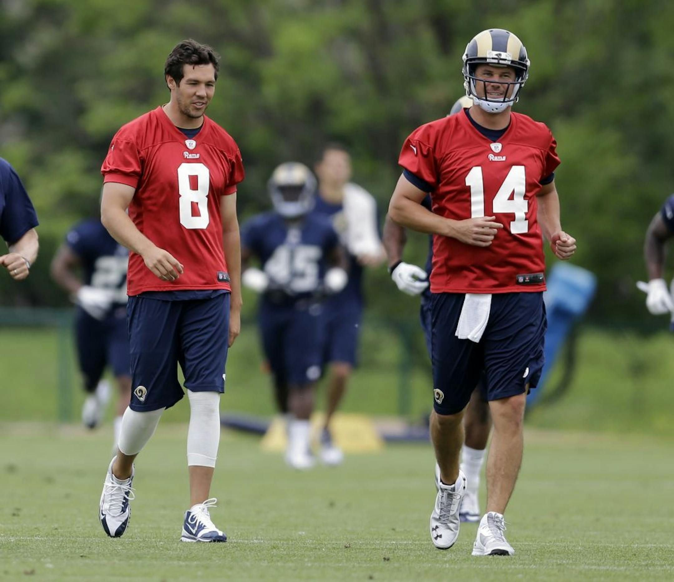 St. Louis Rams quarterbacks Sam Bradford, left, and Shaun Hill are seen during an organized team activity at the NFL football team's practice facility Thursday, June 5, 2014, in St. Louis.