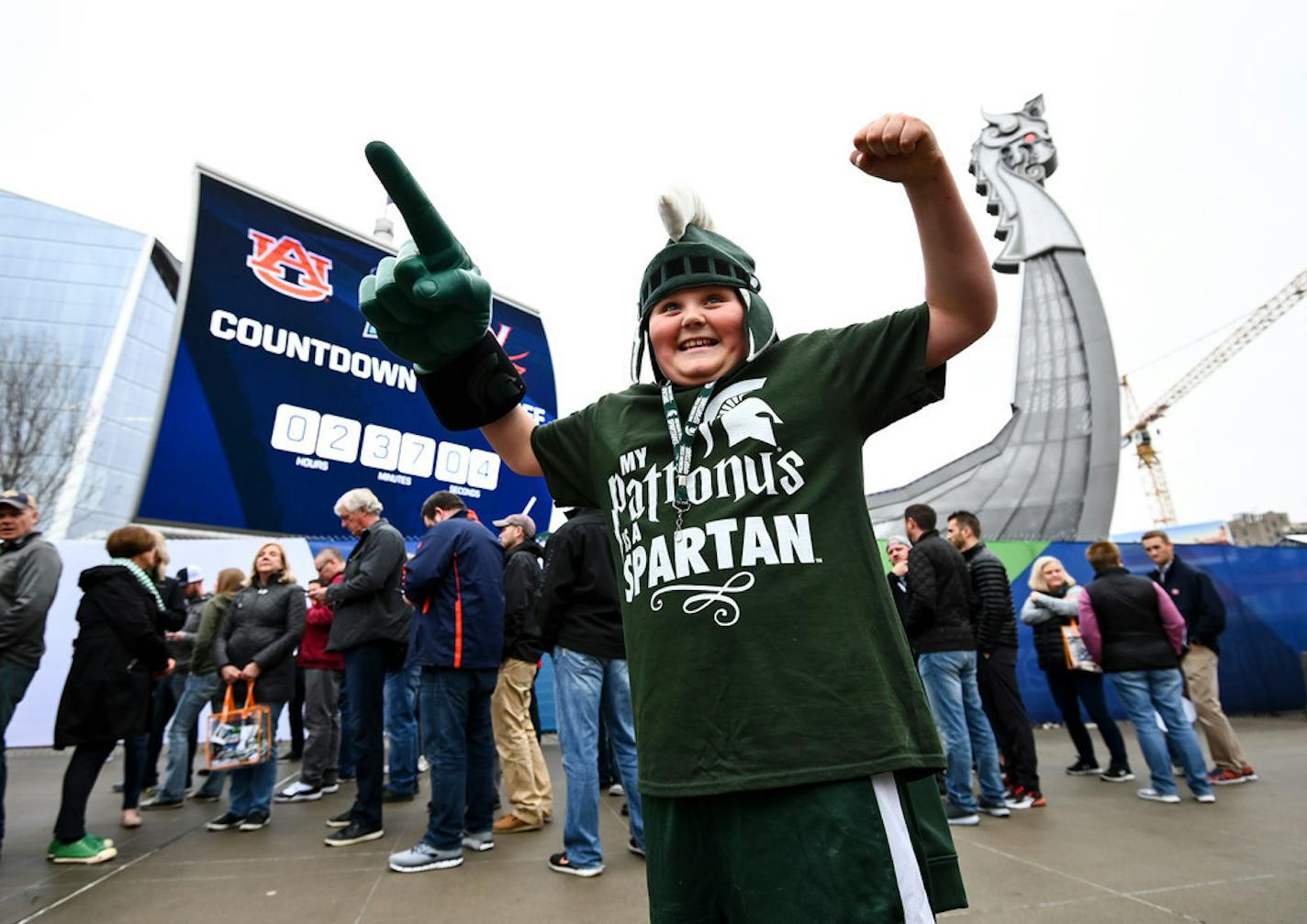 Tristan Dieterle, 10, from Michigan's Upper Peninsula, showed his excitement with meeting Michigan State's Sparty mascot as he waited with his aunt, cousin and grandmother for the gates to open before the Final Four on Saturday.