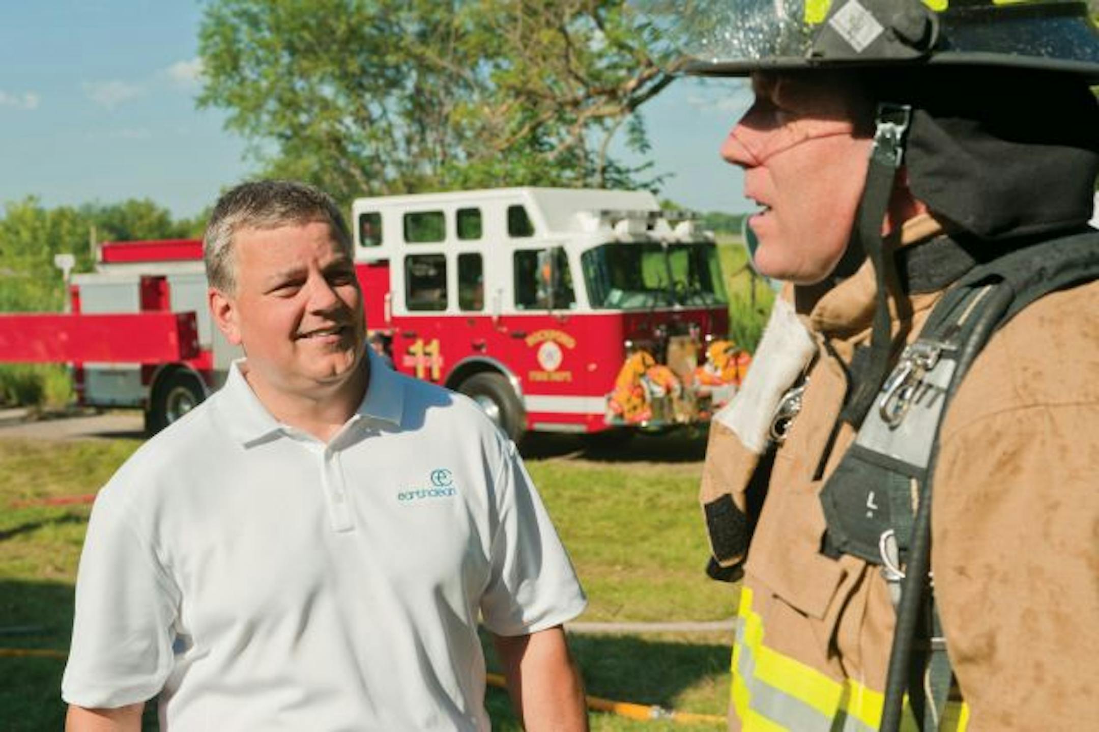 EarthClean CEO Doug Ruth talked to Woodbury volunteer firefighter Terry Lund, whose concerns several years ago led several Minnesota engineers and chemists to develop TetraKO, a sticky, cornstarch-based fire retardant gel said to be less dangerous to humans and the environment than chemical foams.