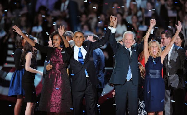 President Barack Obama, first lady Michelle Obama, Vice President Joe Biden and Jill Biden celebrate.