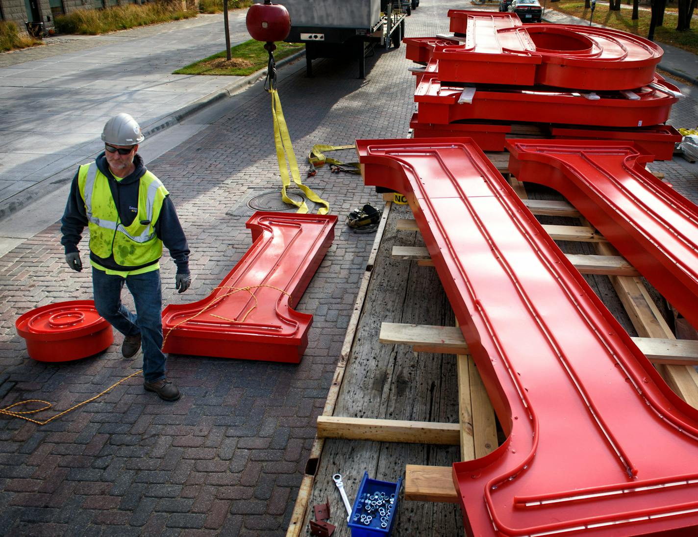 A worker from Lawrence Sign prepped the letter i for hoisting to the Mill roof. ] GLEN STUBBE * gstubbe@startribune.com Tuesday, October 20, 2015 The St. Anthony Main strip and A Mill Artists Lofts is getting its Pillsbury mojo back. Work is underway to reinstall the 30-foot tall Pillsbury's Best Flour sign, which sits atop a red tile silo building connected to the Pillsbury Mill. Owen Metz, of Twin Cities-based developer Dominium which is restoring the sign, said removing, restoring and replaci