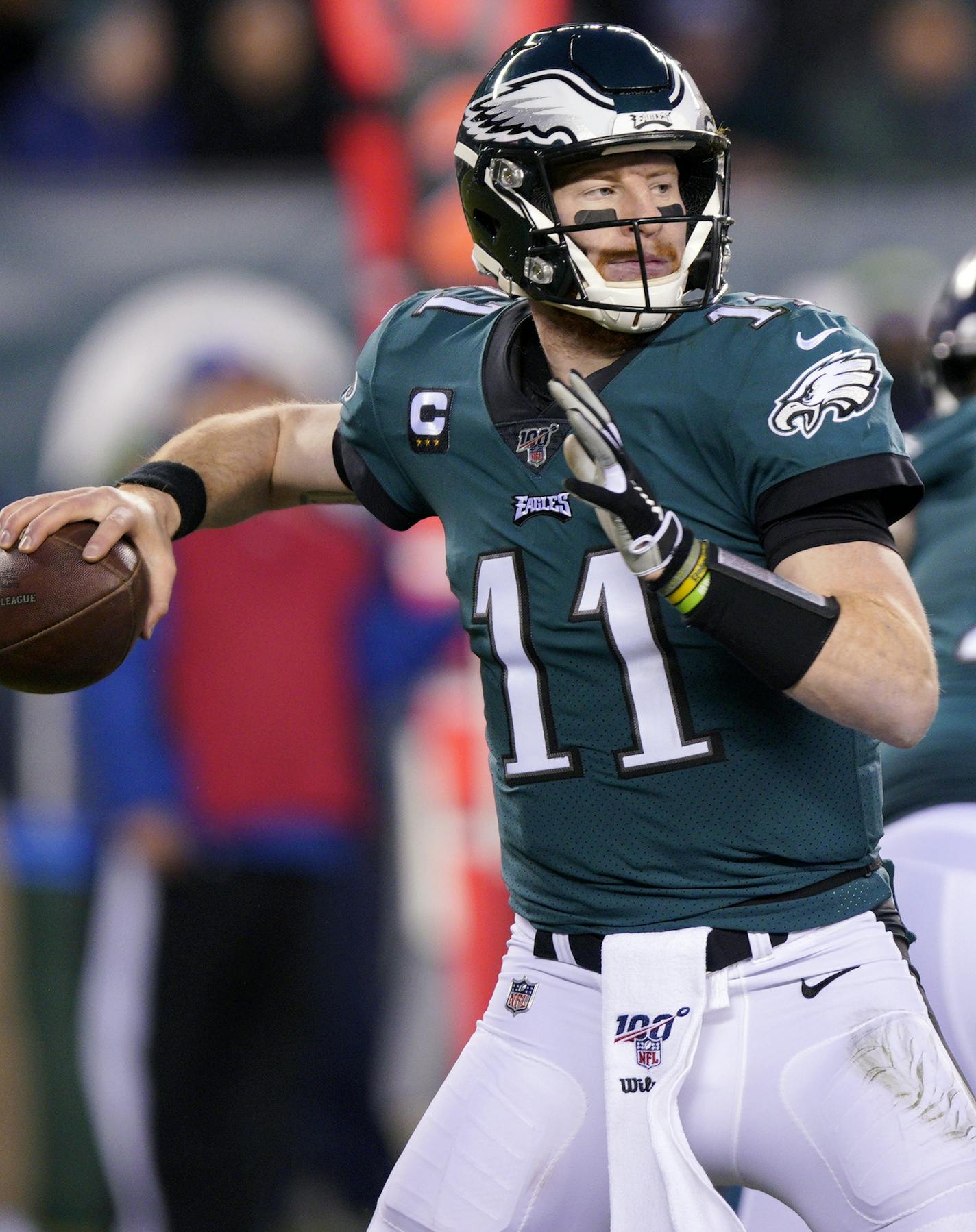 FILE - In this Jan. 5, 2020, file photo, Philadelphia Eagles' Carson Wentz passes during the first half of an NFL wild-card playoff football game against the Seattle Seahawks in Philadelphia. Injuries forced Wentz to watch another quarterback lead the Eagles to their first Super Bowl title and put him on the sideline for playoff games in each of the next two seasons. (AP Photo/Chris Szagola, File)