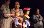 Puppets are used to tell immigrants' stories in Mu Performing Arts' production of Immigrant Journey Project.