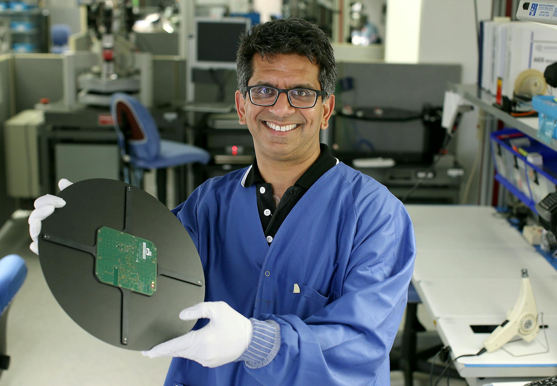 Subodh Kulkarni of CyberOptics, a Golden Valley-based maker of equipment used to make computer chips, held up a new sensor that measures humidity in chip-making, Friday, July 10, 2015 in Golden Valley, MN. ] (ELIZABETH FLORES/STAR TRIBUNE) ELIZABETH FLORES &#x2022; eflores@startribune.com