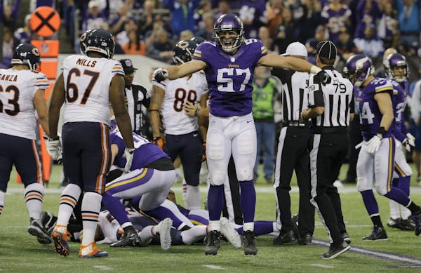 Vikings middle linebacker Audie Cole (57) celebrated a fumble recovery in the second half Sunday against Chicago.