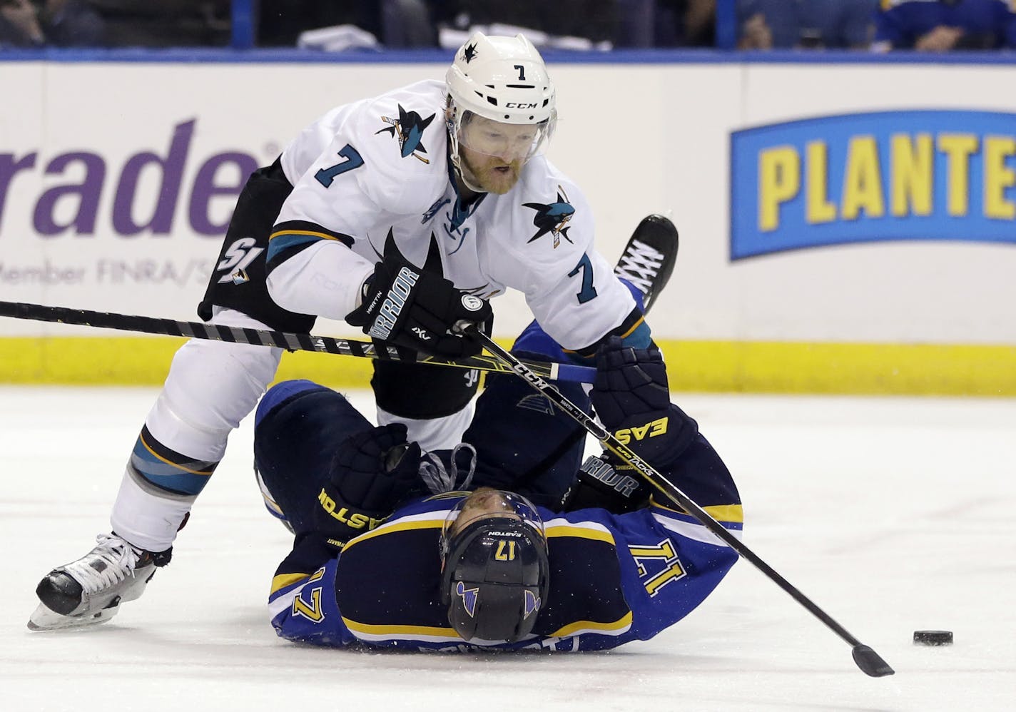 In this Monday, May 23, 2016 file photo, San Jose Sharks defenseman Paul Martin (7) chases the puck against St. Louis Blues left wing Jaden Schwartz (17) during the second period in Game 5 of the NHL hockey Stanley Cup Western Conference finals in St. Louis. Martin and the Sharks will be playing the Pittsburgh Penguins, for whom Martin played for five seasons, in the Stanley Cup finals. (AP Photo/Jeff Roberson, File)