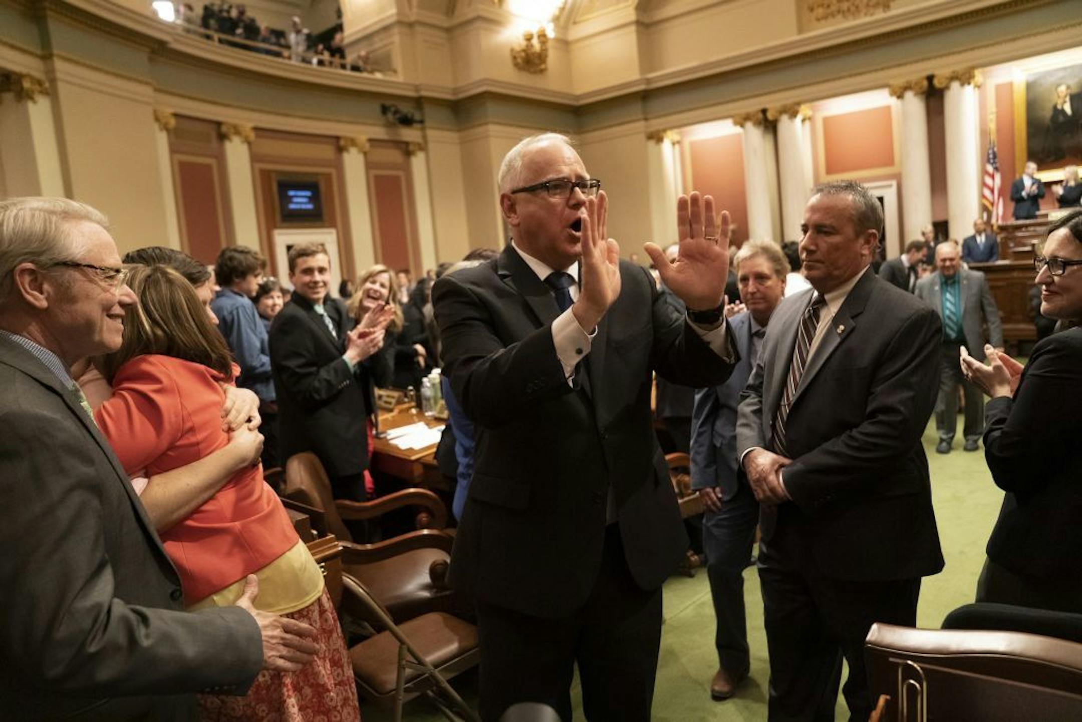 Governor Tim Walz gestured to thank the audience as he left the State of the State Address at the State Capitol in St. Paul, Minn., on Wednesday, April 3, 2019.