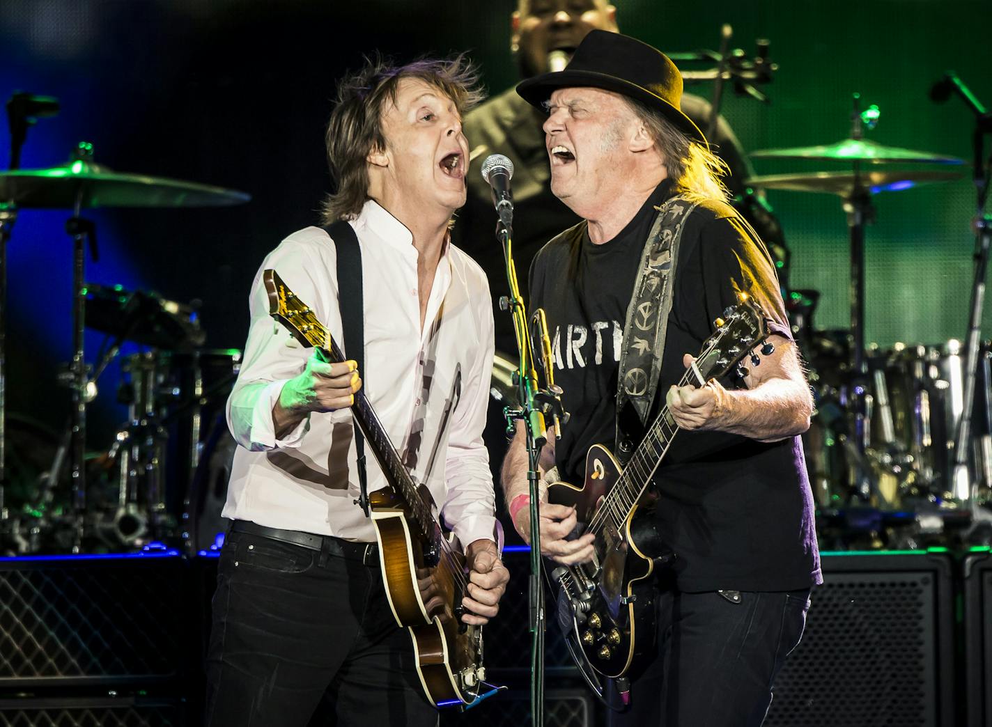 Paul McCartney and Neil Young perform at Desert Trip, the boomer-friendly festival, at the Coachella site in Indio, Calif., Oct. 8, 2016. Tucked away in the tent city of on-site camping at the event was an oasis of relative youth that could have passed for Coachella proper, with beer pong and arcade games. (Carlos Gonzalez/The New York Times)