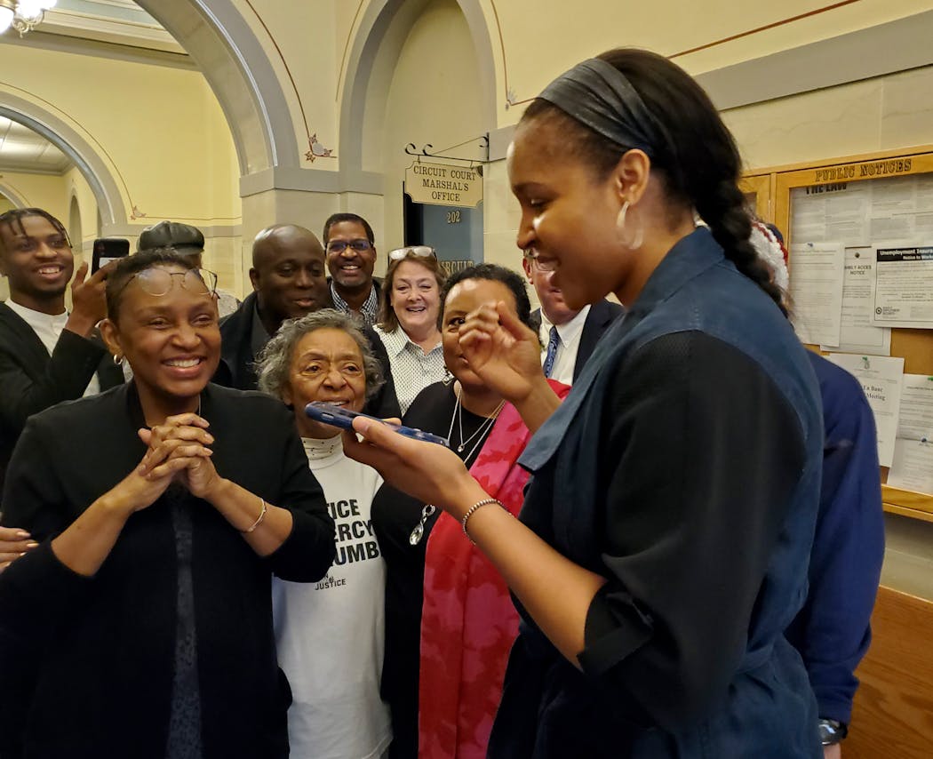 Lynx star Maya Moore called Jonathan Irons on March 9 as supporters react in Jefferson City, Mo., after a judge overturned Irons' convictions in a 1997 burglary and assault case.
