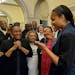 Jefferson City, Mo., native and WNBA star Maya Moore, right, calls Jonathan Irons as supporters react Monday, March 9, 2020, in Jefferson City after C