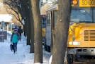 Students walked to their buses in the bitter cold after school at Sanford Middle School on Tuesday, January 16, 2018, in Minneapolis, Minn. Sanford an