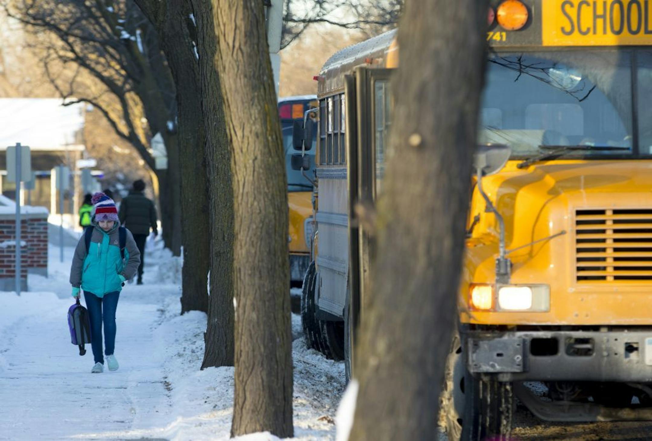 Students walked to their buses in the bitter cold after school at Sanford Middle School on Tuesday, January 16, 2018, in Minneapolis, Minn. Sanford and all other grades six through eight middle schools would be starting late at 9:30 a.m.
