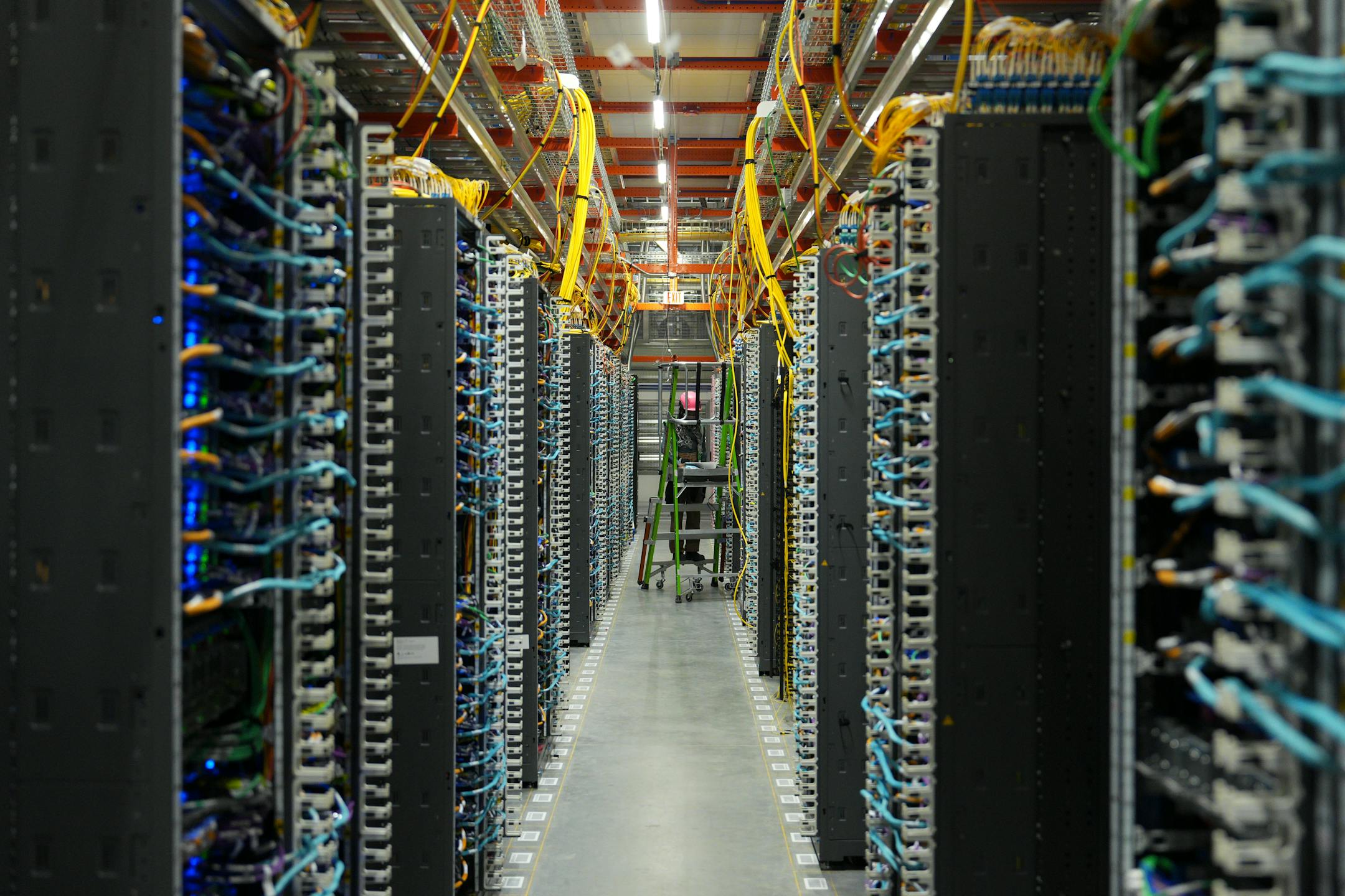 Racks of servers at the new Amazon Web Services facility in New Carlisle, Ind., where the tech giant plans to build around 30 data centers, on June 3, 2025.
