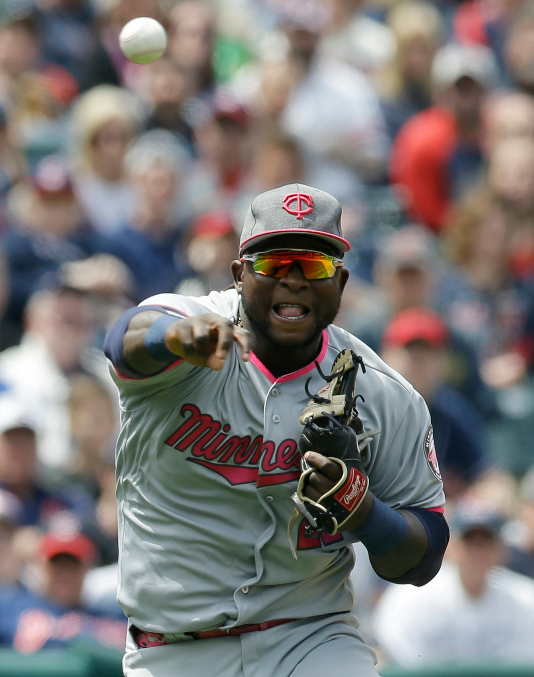 Minnesota Twins' Miguel Sano throws out Cleveland Indians' Daniel Robertson at first base in the third inning of a baseball game, Sunday, May 14, 2017, in Cleveland.
