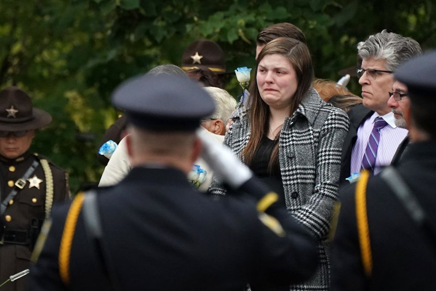 Family members, including wife Andrea Parise, center, stood by as flag was carried into Fort Snelling Memorial Chapel for Tuesday's funeral of Oak Park Heights correctional officer Joe Parise.