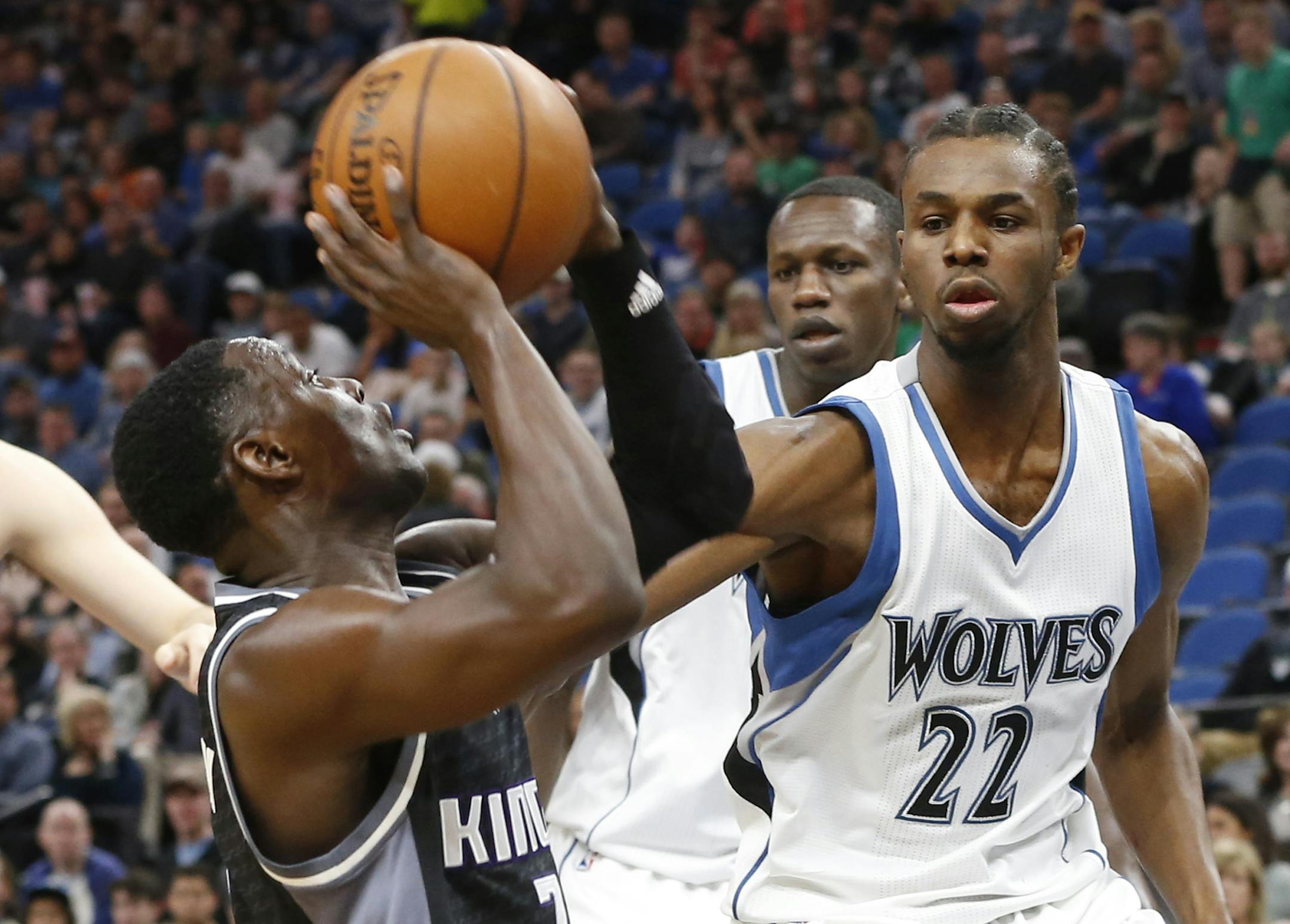 Sacramento Kings' Darren Collison, left, eyes the basket as Minnesota Timberwolves' Andrew Wiggins defends during the first half of an NBA basketball game Saturday, April 1, 2017, in Minneapolis. (AP Photo/Jim Mone)