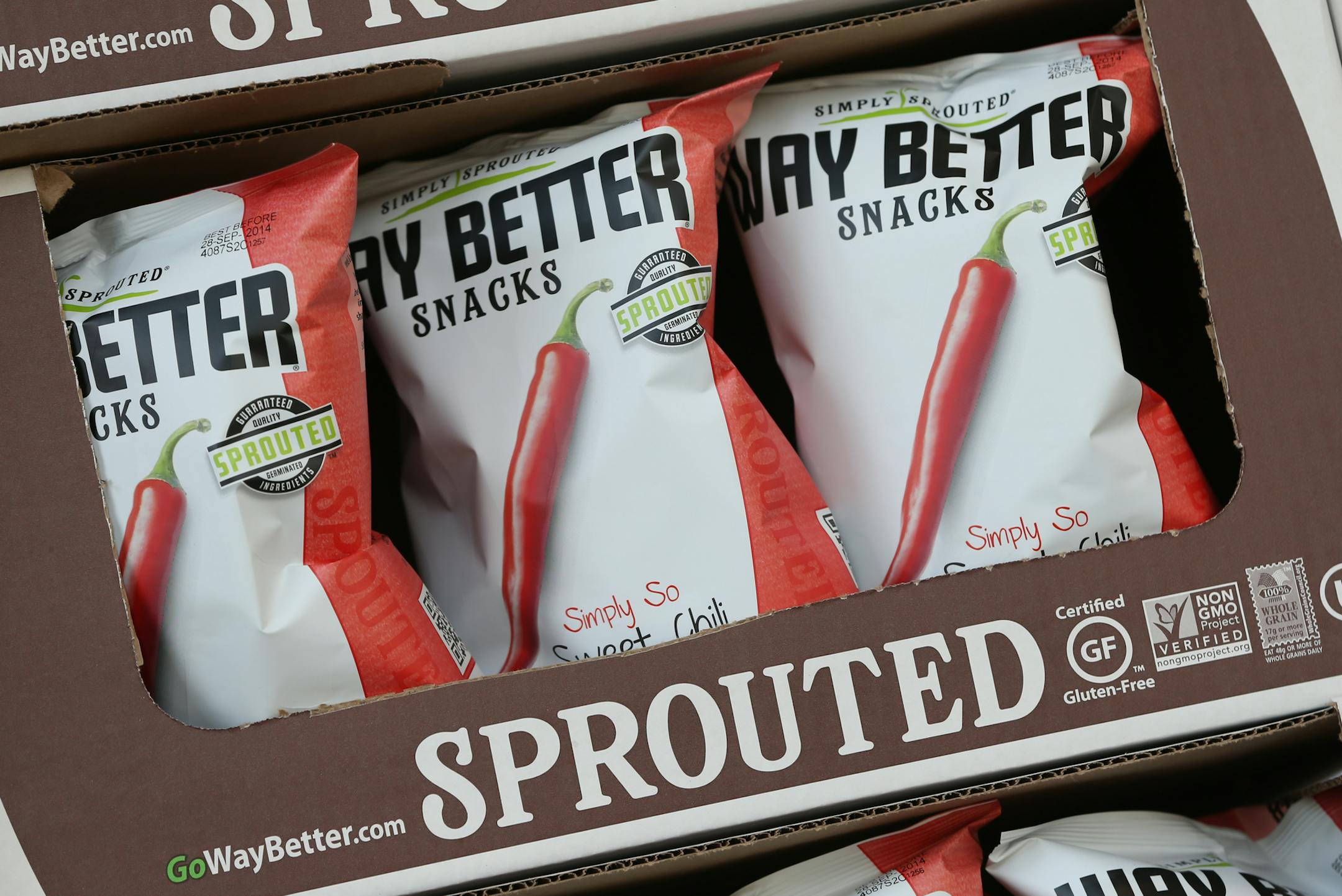Way Better Snacks display at the downtown Whole Foods store on 5/30/14. Jim Breen, the entrepreneur who moved his Live Better healthy snacks from New York to the Waerhouse District in 2013, has acquired a key Canadian supplier that grows sprouts, amid a growth spurt that will double employment to 30 and sales close to $25 million of Breen's Way Better Snacks this year. The premium priced chips contain a variety of vegetable seeds and sold at Whole Foods, Lunds and 20,000 other stores across the
