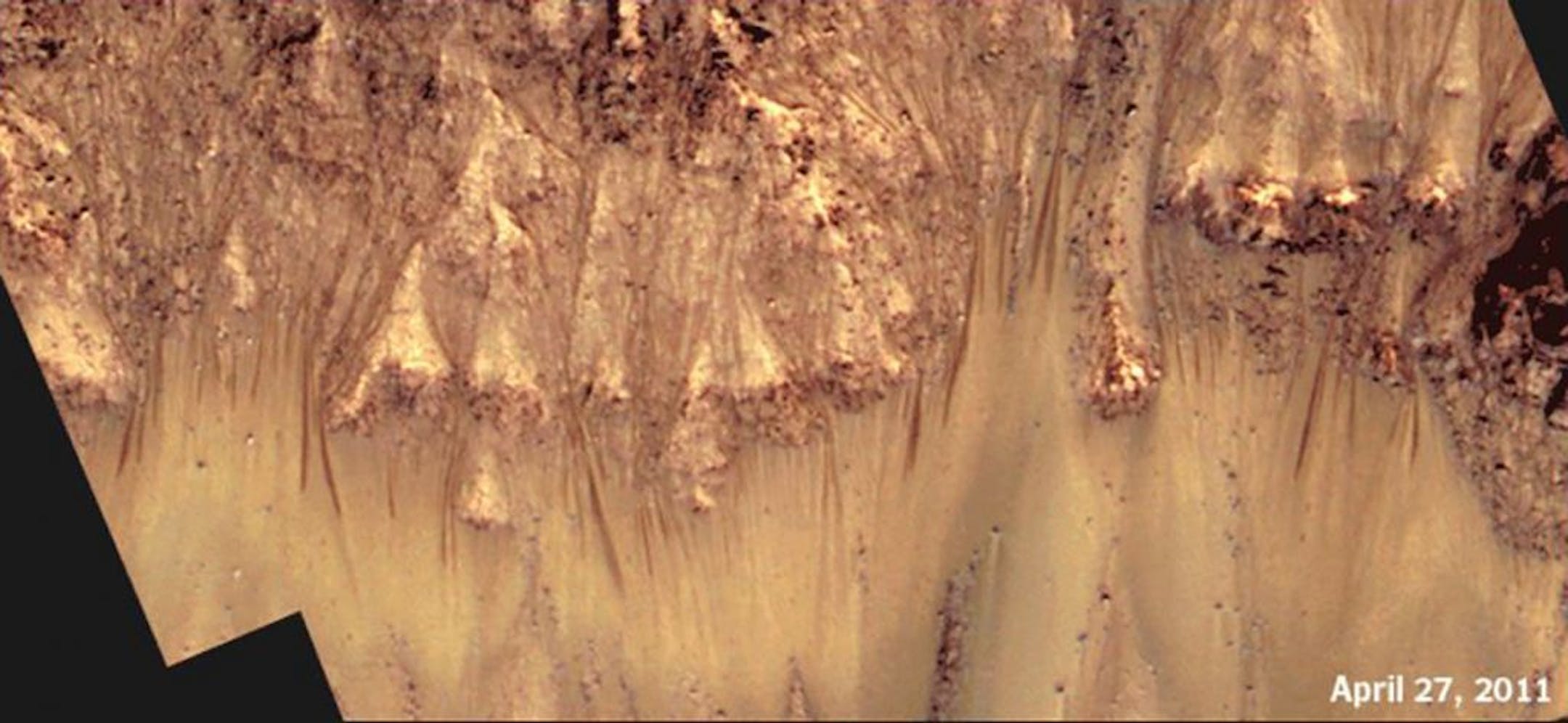 A time-lapse animation of Palikir Crater shows how the streaks extend and darken during warmer months on Mars, then gradually fade as temperatures cool. Image date April 27, 2011