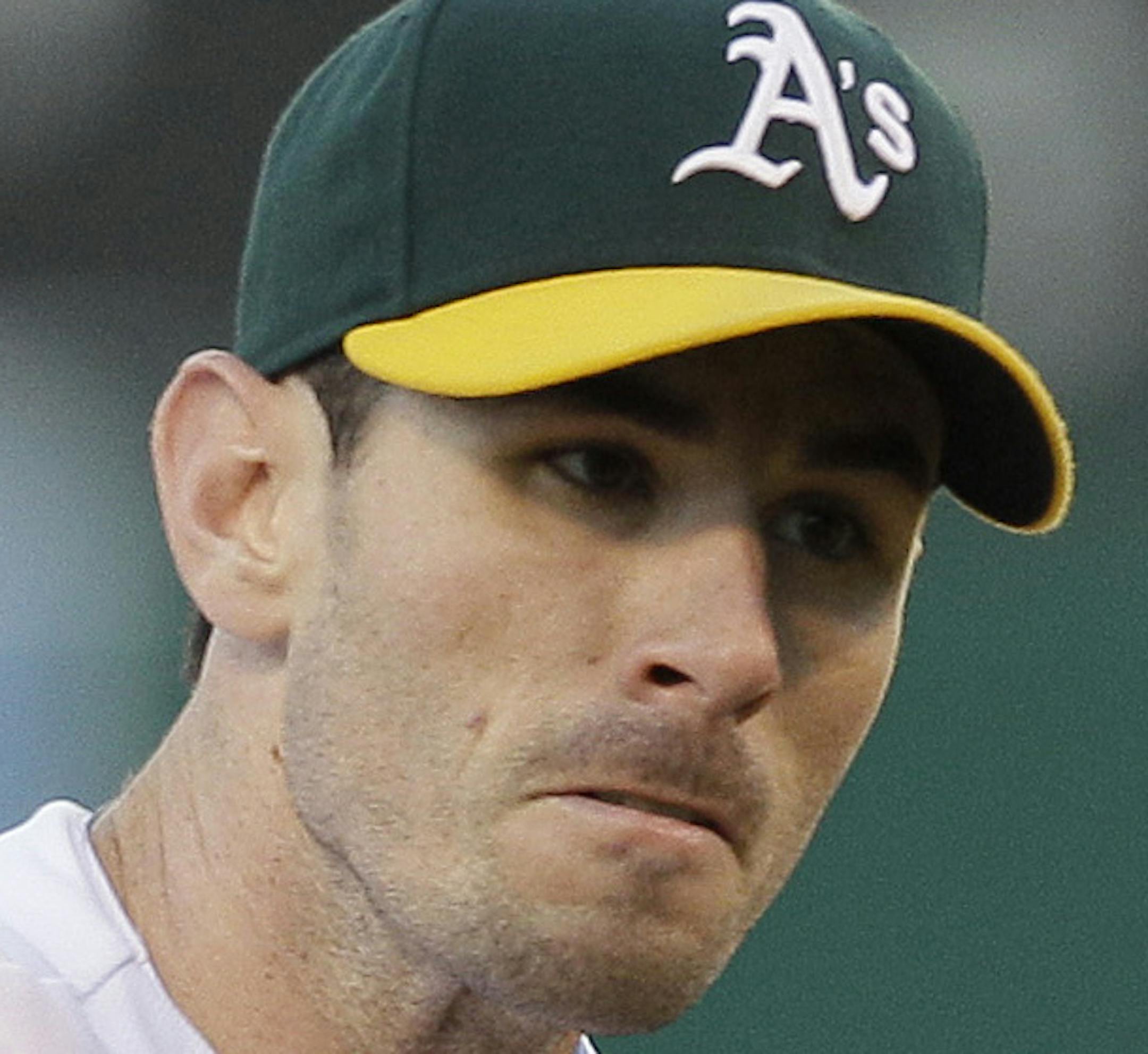 Oakland Athletics pitcher Brandon McCarthy works against the Minnesota Twins in the second inning of a baseball game in Oakland, Calif., Wednesday, May 18, 2011. (AP Photo/Jeff Chiu)