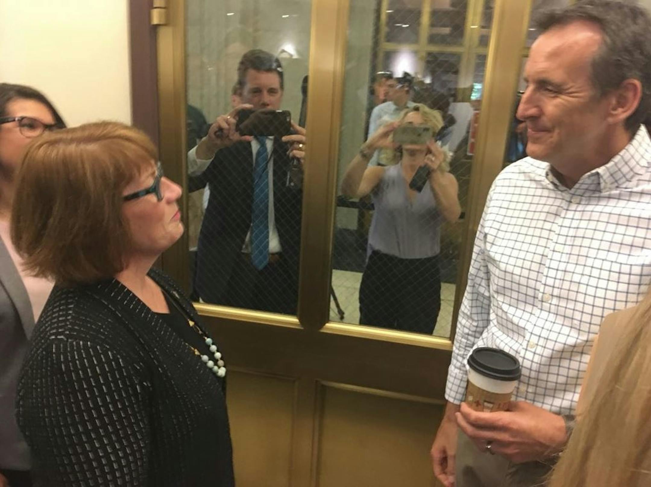 Democratic gubernatorial candidate Erin Murphy and GOP gubernatorial candidate Tim Pawlenty greet each other as they filed their candidacies at the secretary of state's office Tuesday, June 5.