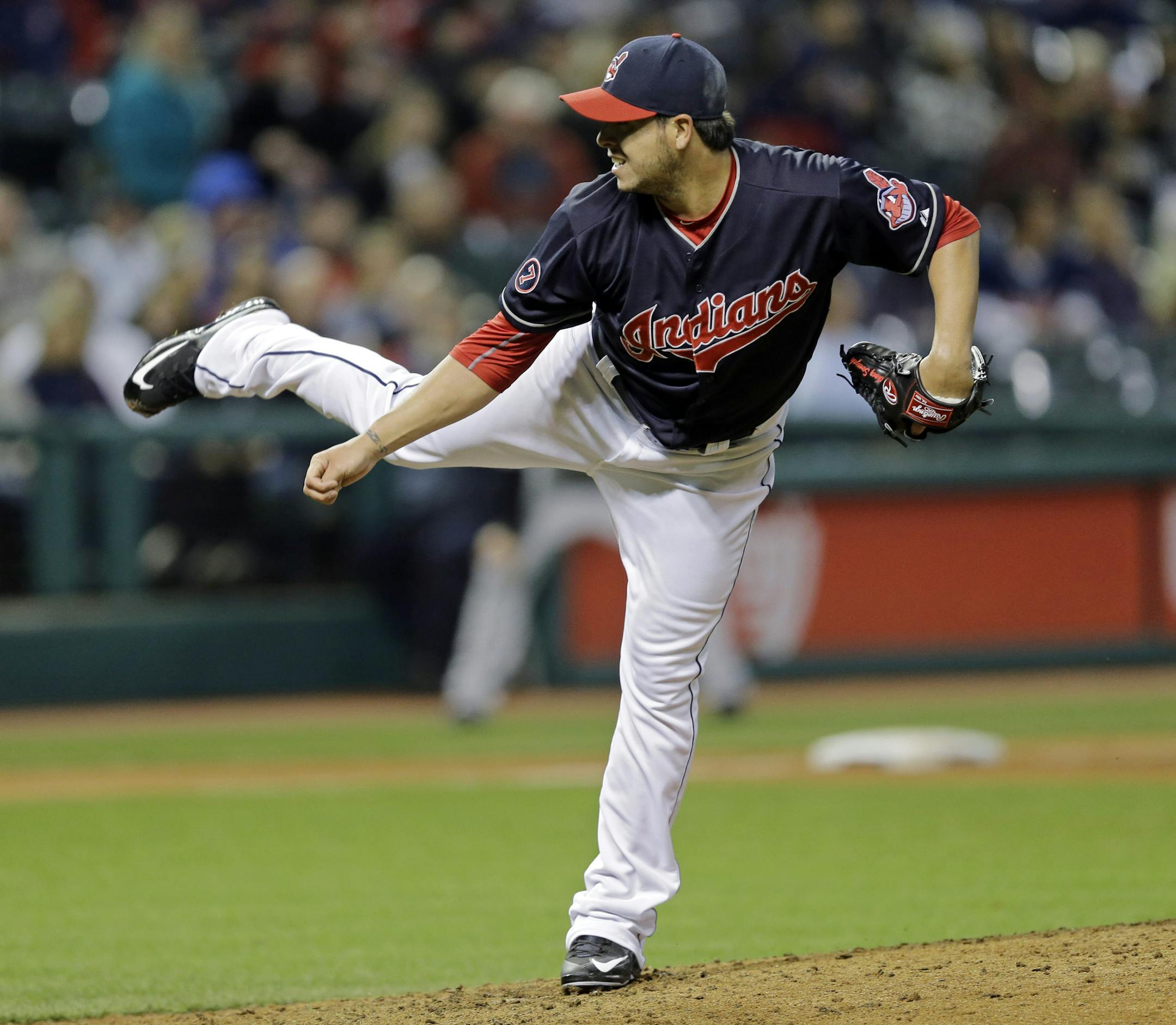 Cleveland Indians' Anthony Swarzak follows through on a pitch against the Chicago White Sox in the sixth inning of a baseball game Tuesday, April 14, 2015, in Cleveland. (AP Photo/Mark Duncan) ORG XMIT: MIN2015042418383157