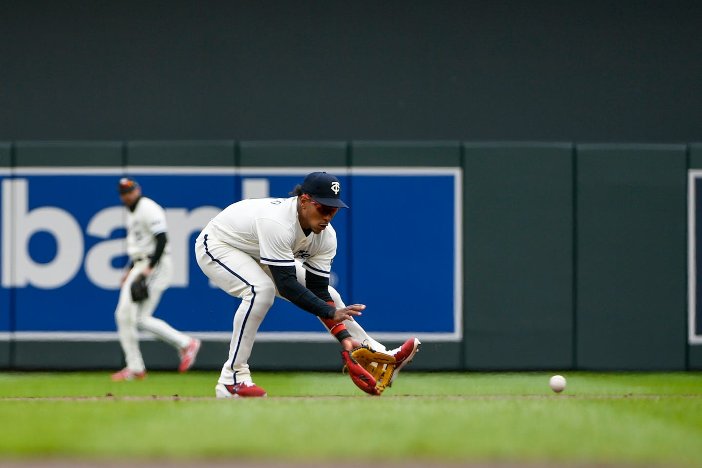 Minnesota Twins second baseman Jorge Polanco catches a ground ball hit by Washington Nationals designated hitter Joey Meneses during the sixth inning of a baseball game, Sunday, April 23, 2023, in Minneapolis. (AP Photo/Craig Lassig)