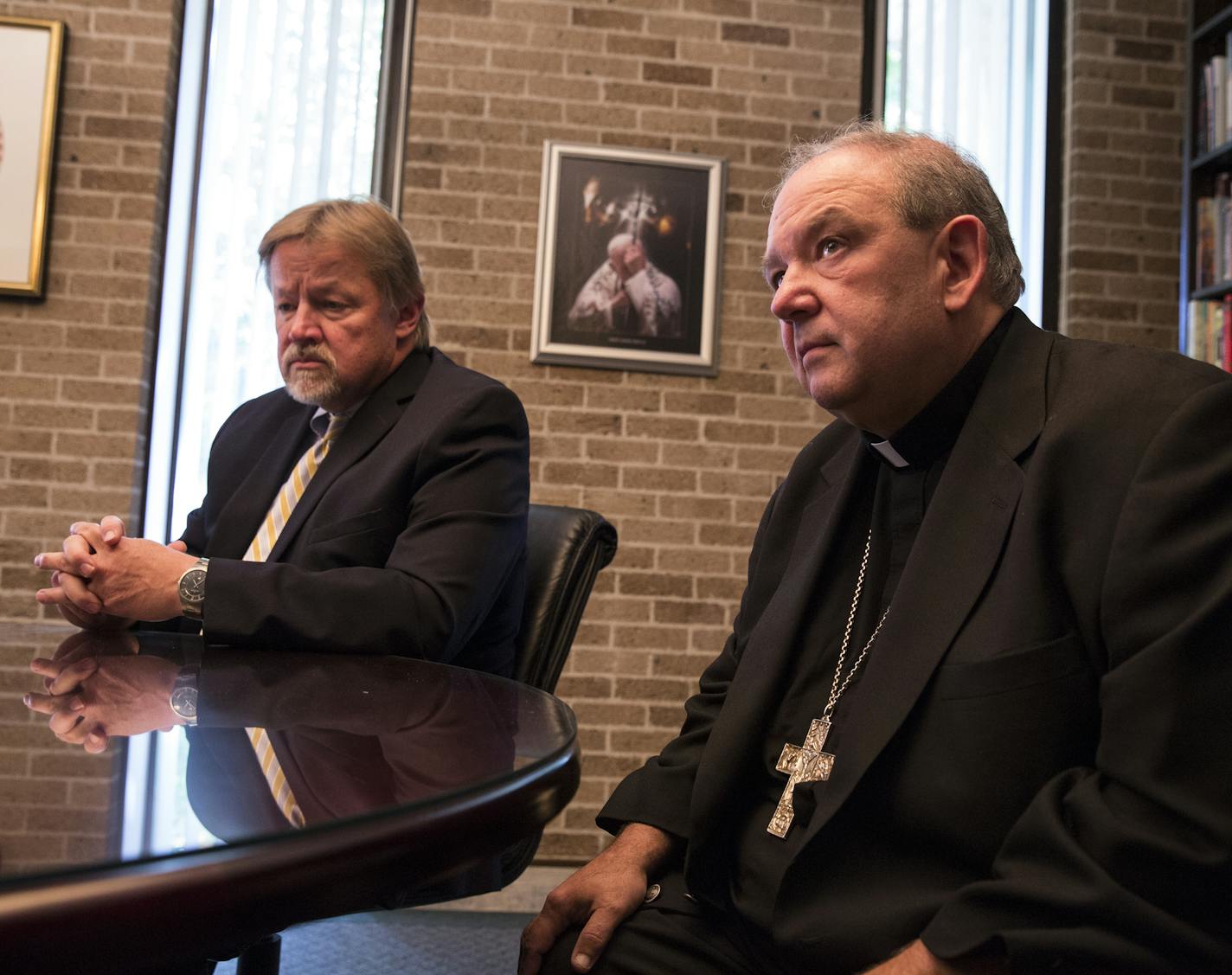 Archbishop Bernard Hebda, right, and the archdiocese's bankruptcy attorney Charles Rogers speak during an interview at the offices of the Archdiocese of St. Paul on Tuesday, August 4, 2015. ] LEILA NAVIDI leila.navidi@startribune.com / BACKGROUND INFORMATION: With the deadline for filing claims against the St. Paul and Minneapolis archdiocese now closed, the church is facing more than 650 claims in bankruptcy court for everything from parish insurance overpayments to media services. While the va