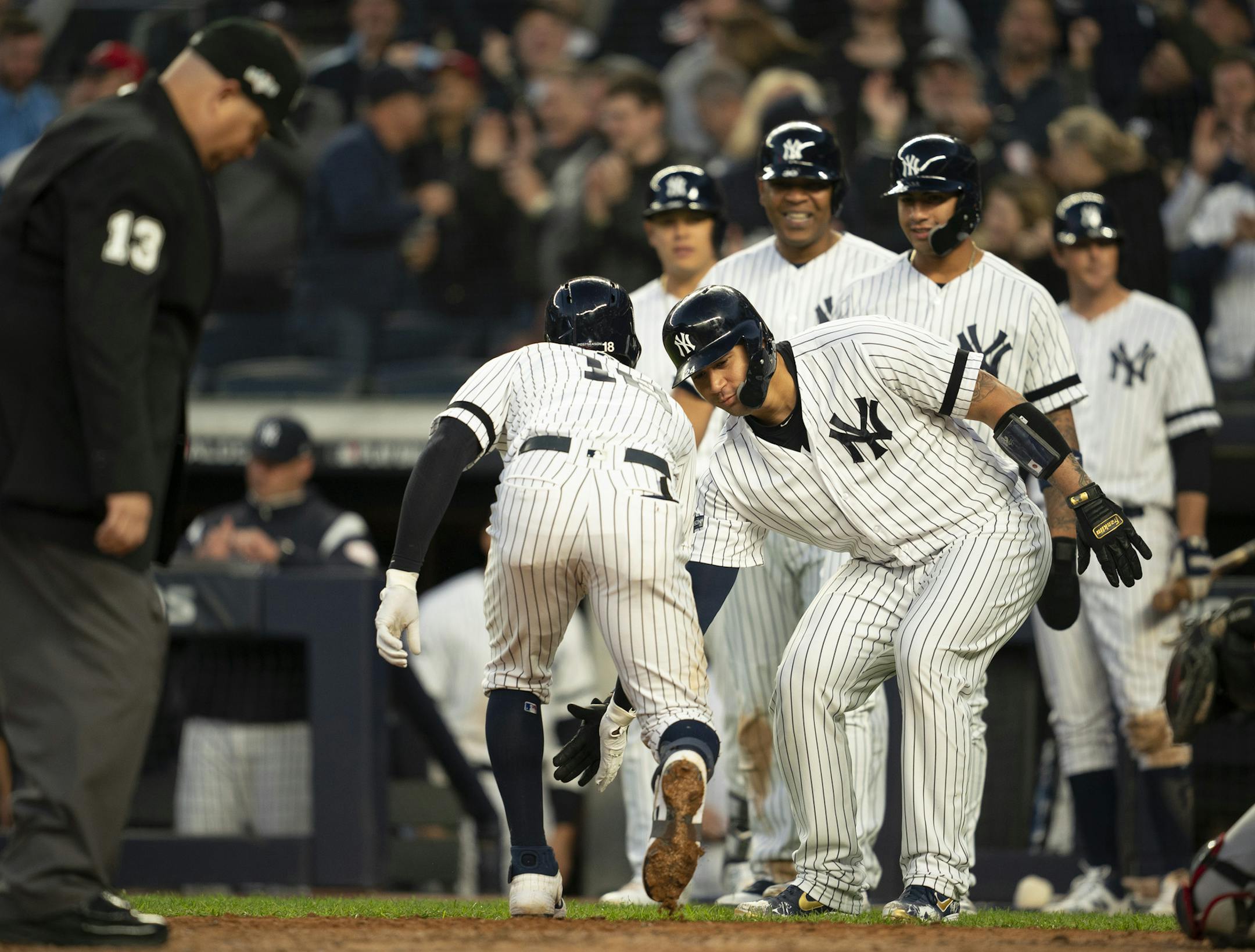 New York Yankees shortstop Didi Gregorius was congratulated by New York Yankees catcher Gary Sanchez (24) after he knocked a grand slam home run in the third inning. ] JEFF WHEELER • jeff.wheeler@startribune.com The Minnesota Twins met the New York Yankees met in Game 2 of their American League Division Series Saturday night, October 5, 2019 at Yankee Stadium in New York.
