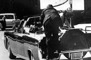 FILE -- President John F. Kennedy slumped down in back seat of car after being fatally shot in Dallas in this Nov. 22, 1963 file photo. Jacqueline Ken